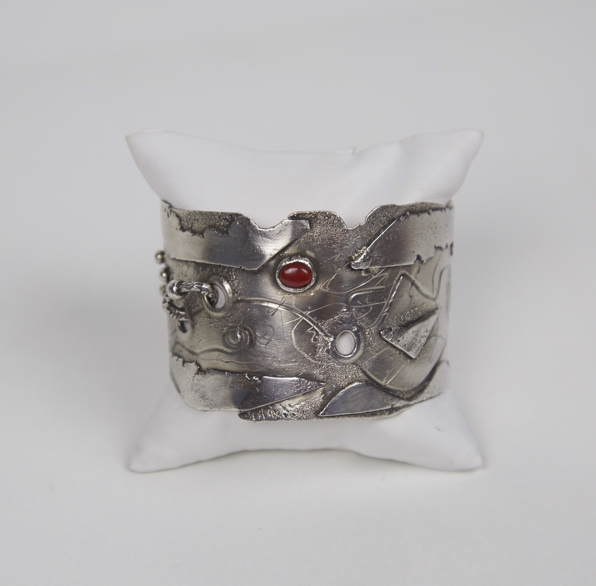 Sterling silver cuff with coral cabochon stone by Jeri Mitrani
