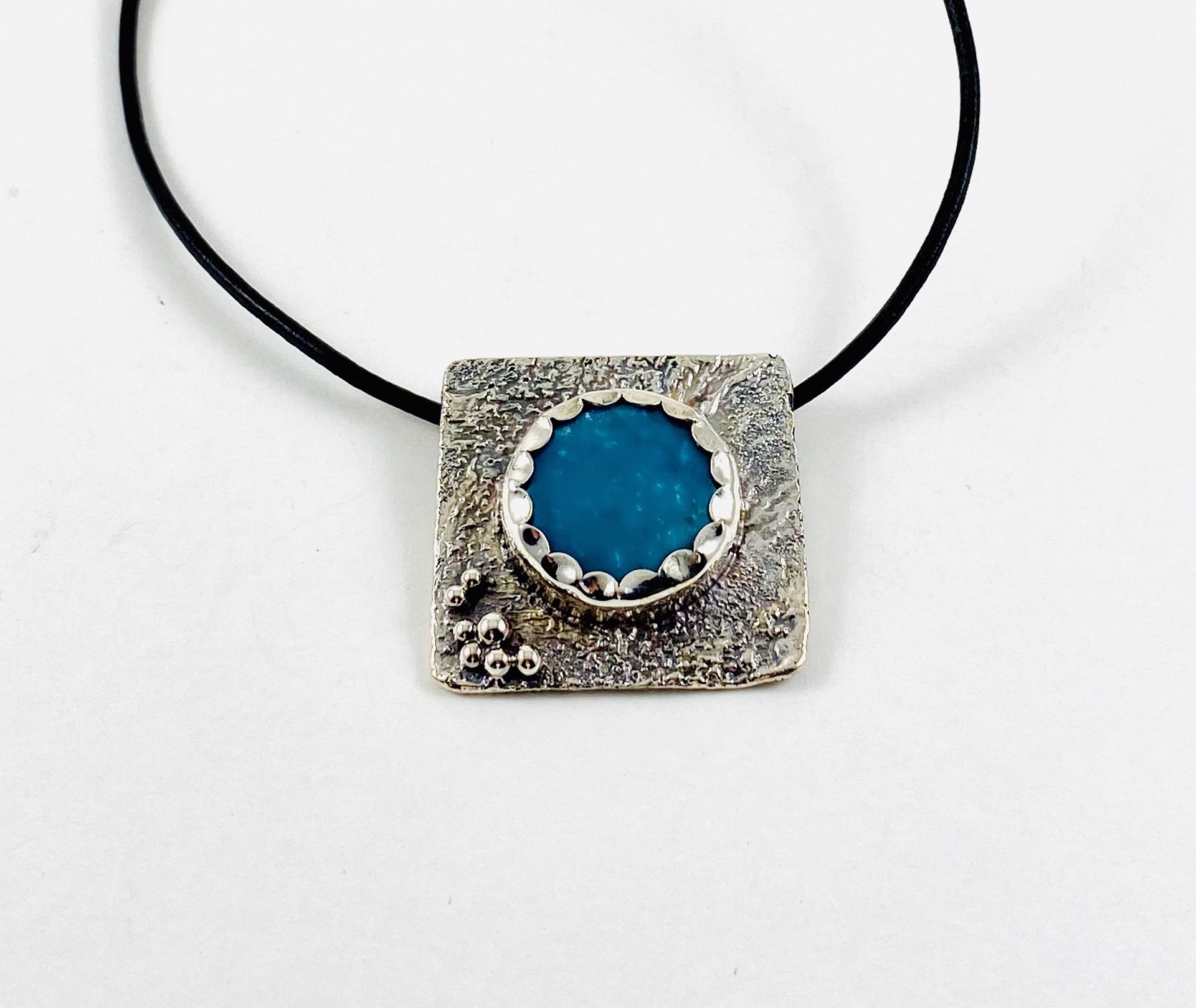 Kingsman Turquoise, Reticulated  Silver pendant, 16" leather by Anne Bivens