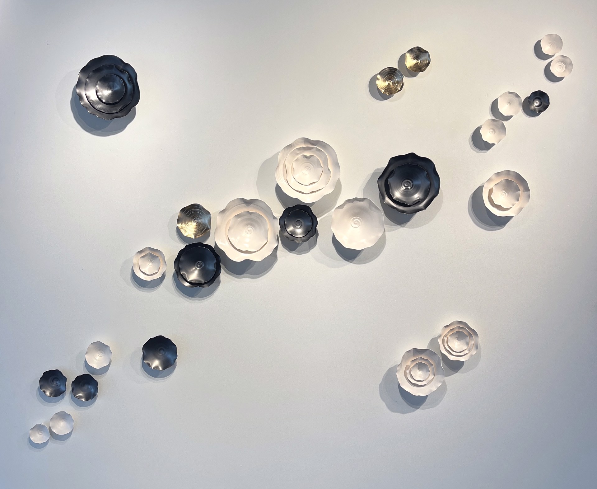 Lucrecia Waggoner Porcelain Wall Installation Custom Artwork Lucrecia Waggoner Intertwined III, 2023 Gunmetal, polished porcelain, and moongold accents5 x 7 ft 