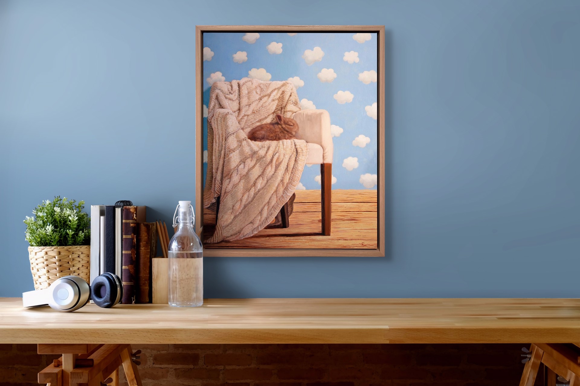 "Dreamer" by Lucia Heffernan, an oil painting depicting a cozy interior with a chair draped in a textured blanket, set against a whimsical sky with fluffy clouds.