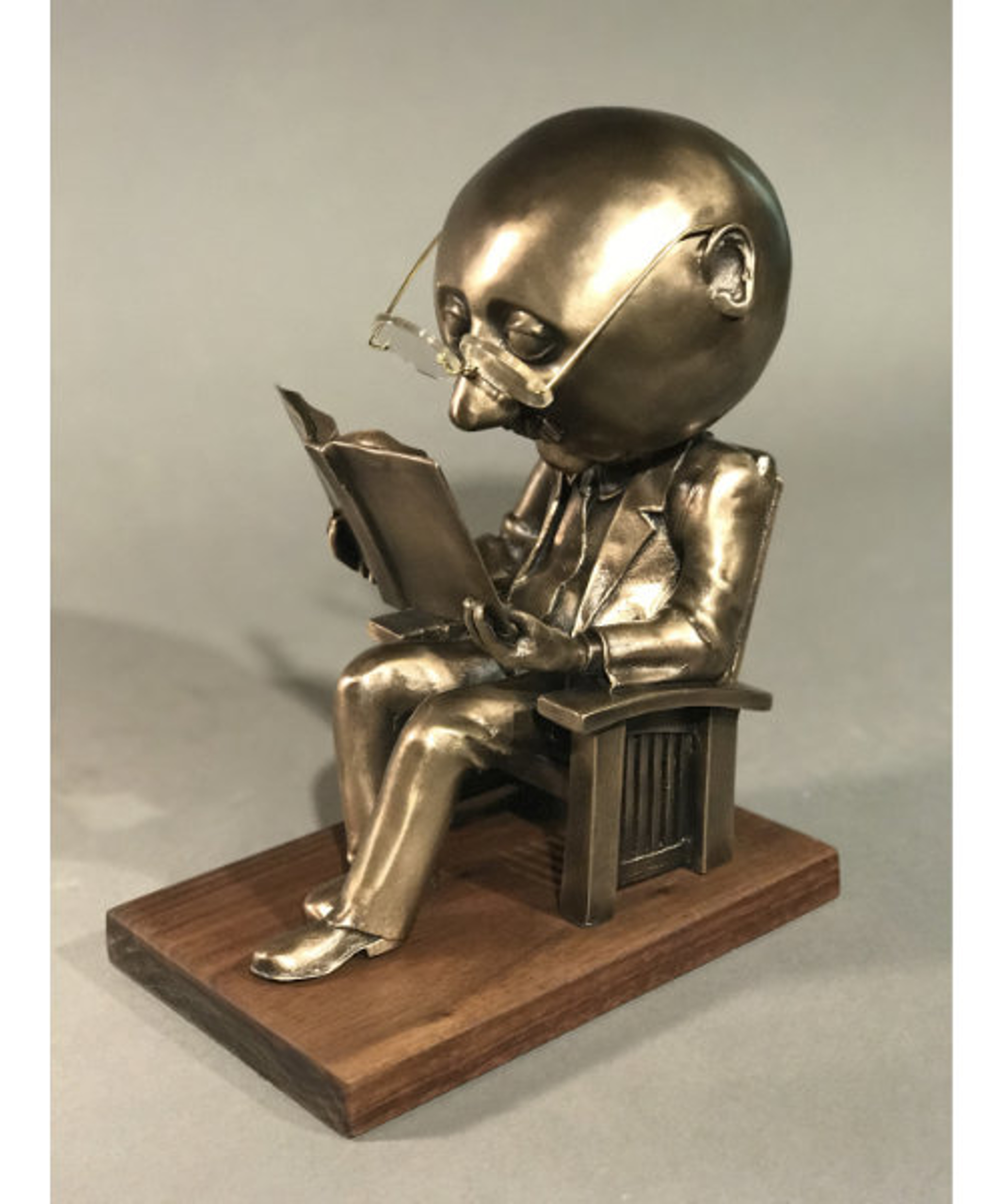 The Reader (small) bronze edition 100 by Rodger Jacobsen