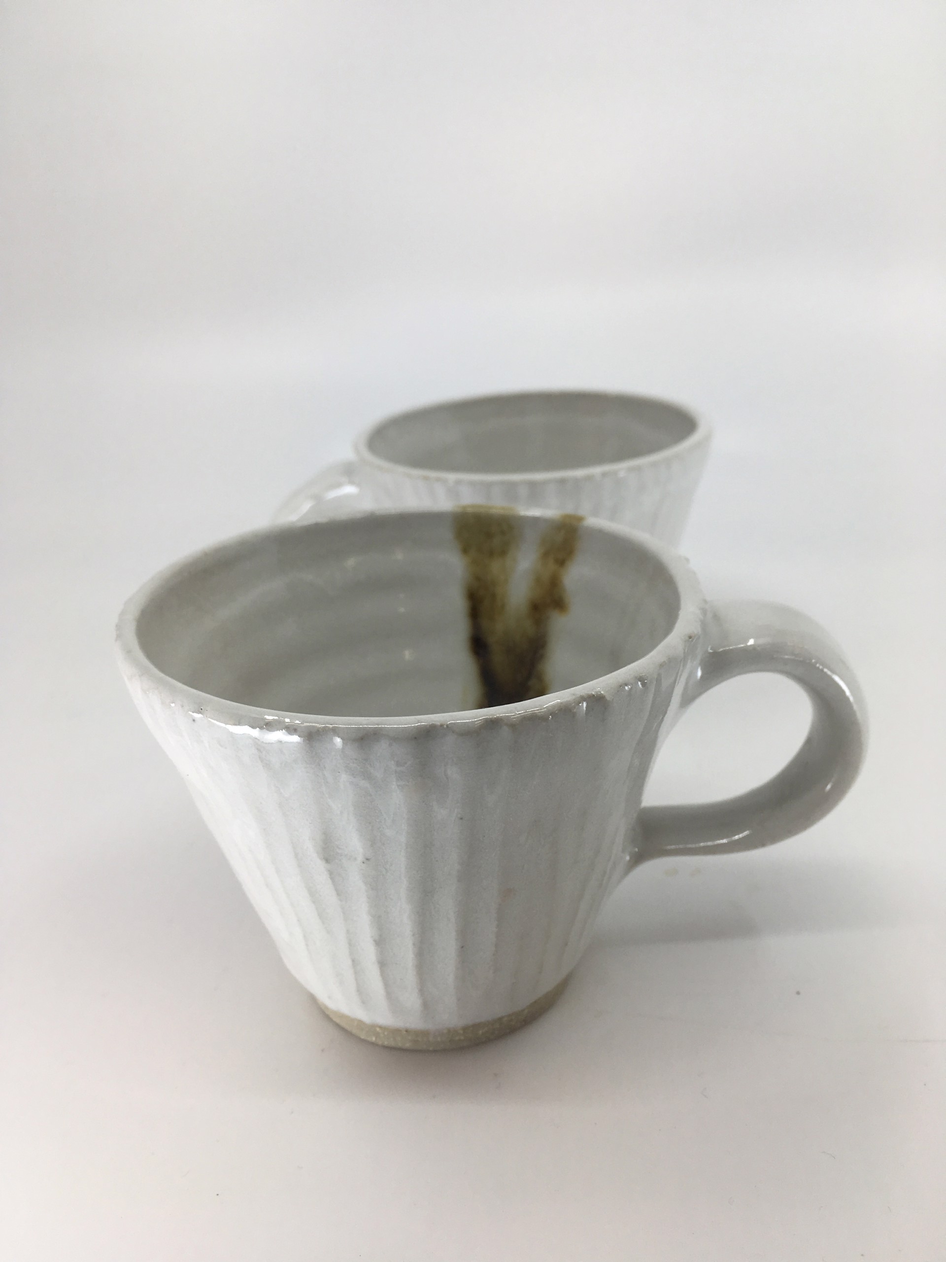 Teacup, vertically carved with amber drip by Monica Plank