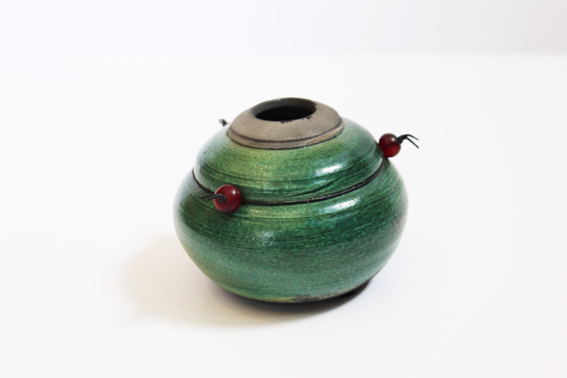 Small Raku Pot with Horn by Mary Lynn Portera