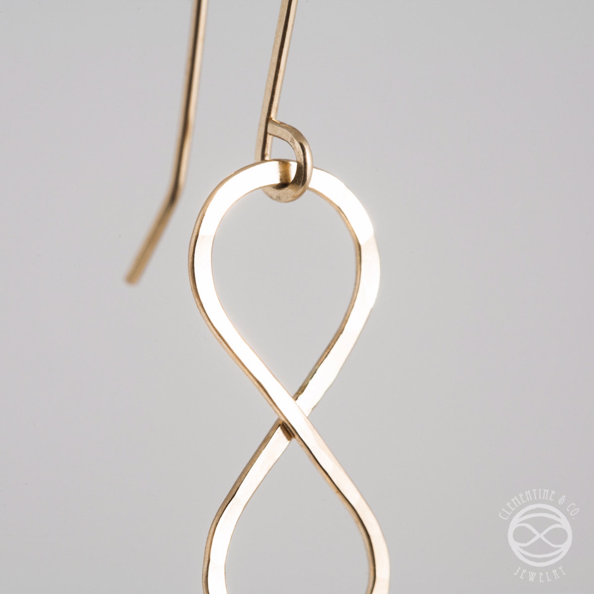 Infinity Earrings in Gold by Clementine & Co. Jewelry