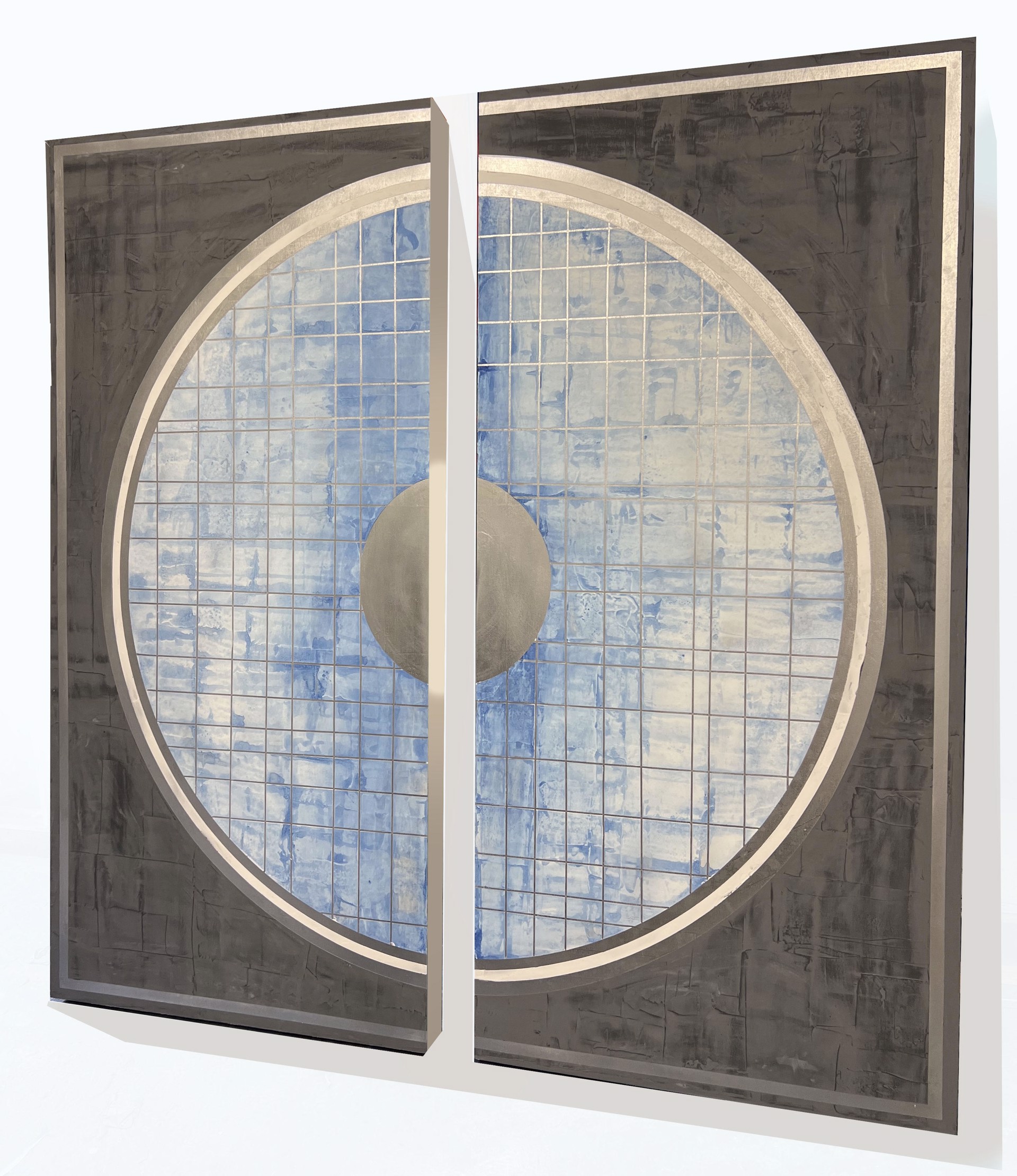 California artist and painter Stephanie Paige's 60"H x 60"W painting Quietude is a beautiful diptych made of two wood panels with layers of grey marble plaster paint and features a quilted textured circle with whites and blues.