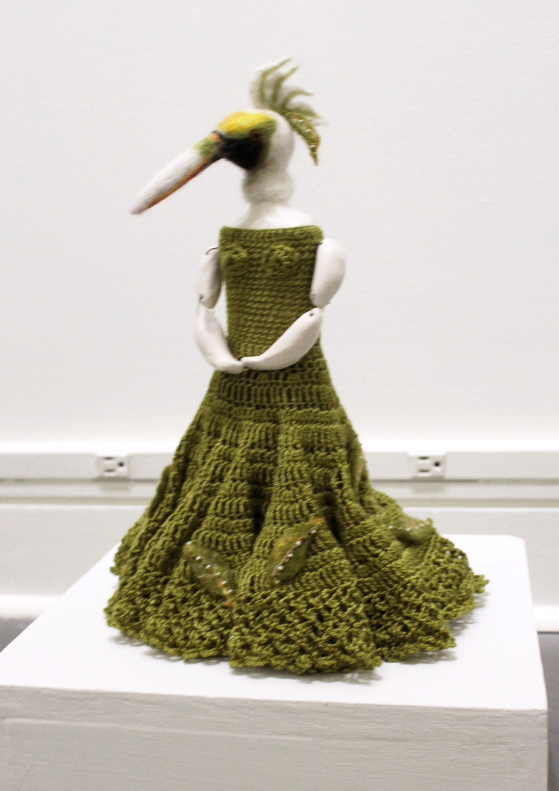 Untitled (standing bird in green dress) by Eva Maier