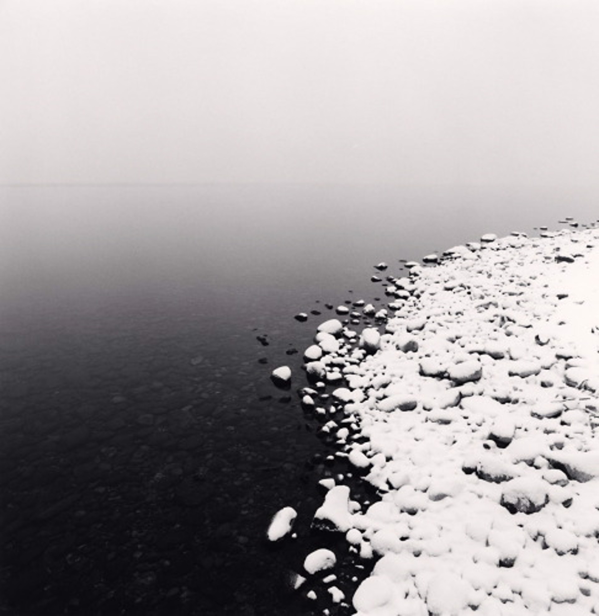 Snow on Pebbles, Toya Lake, Hokkaido, Japan (edition of 45) by Michael Kenna