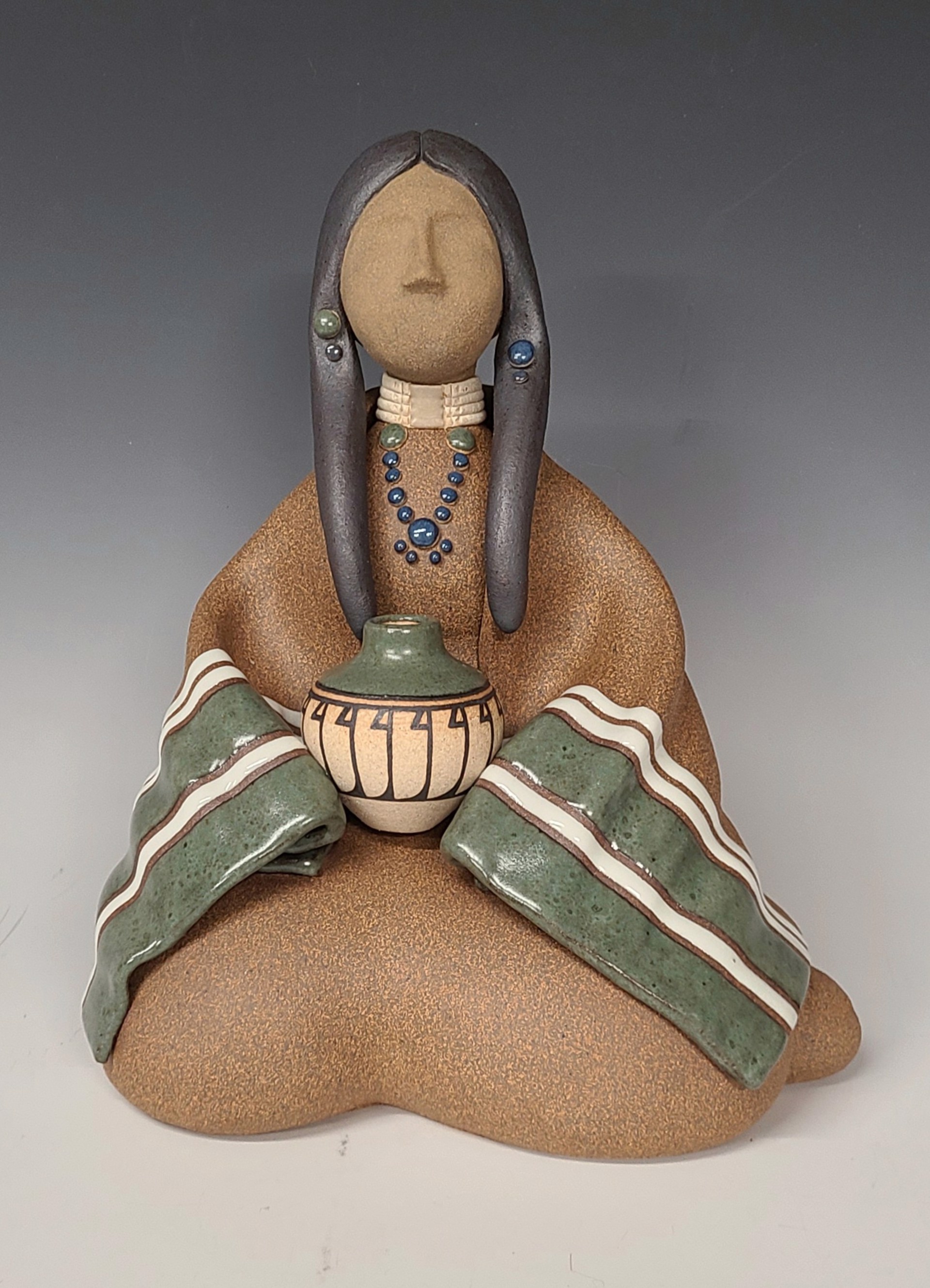 Lakota Maiden Seated-Green by Terry Slonaker