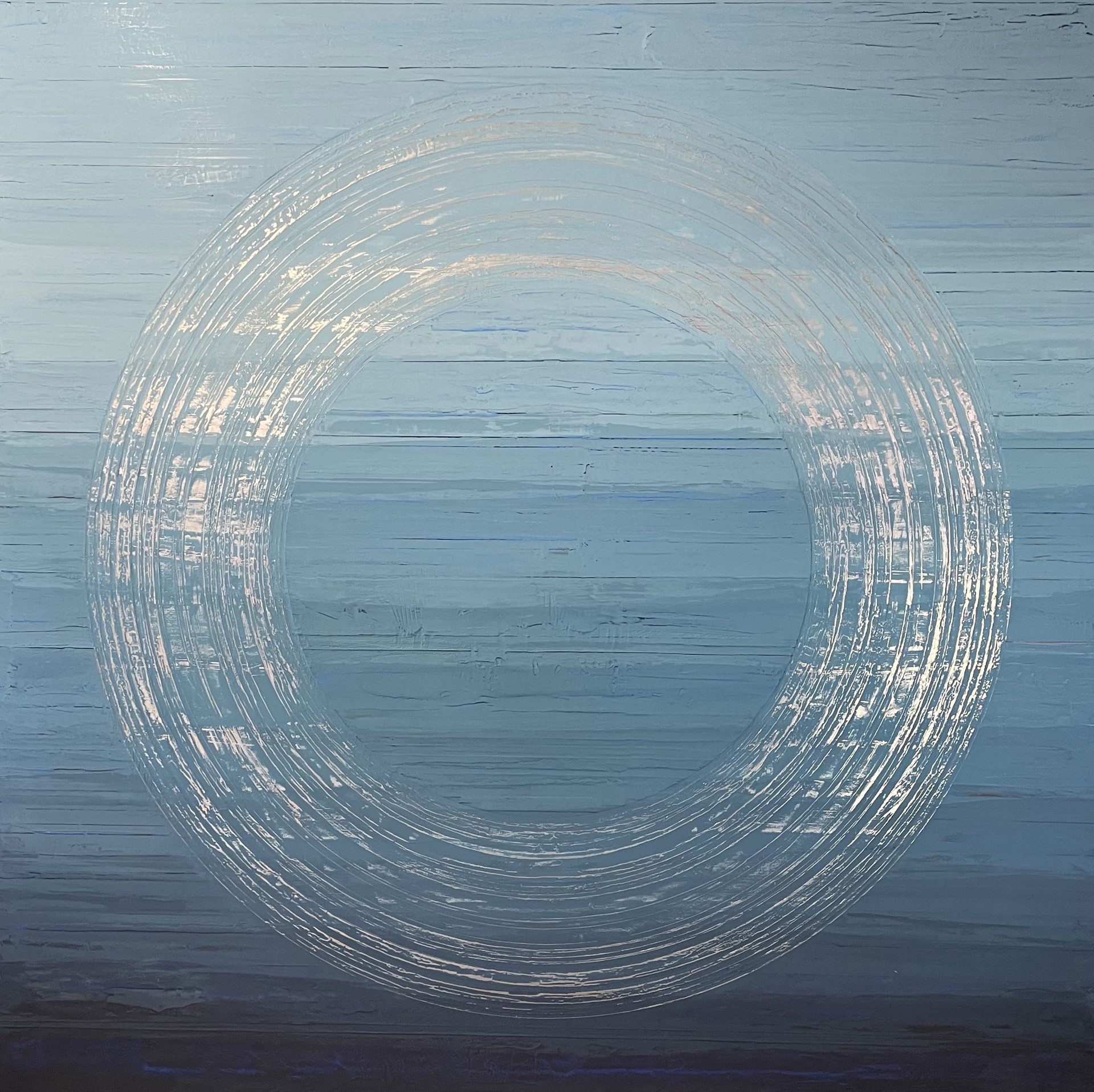Endless Love is a 72"H x 72"W abstract painting by California artist and painter Stephanie Paige. It is has a blue scale marble plaster background with silver circular striations.