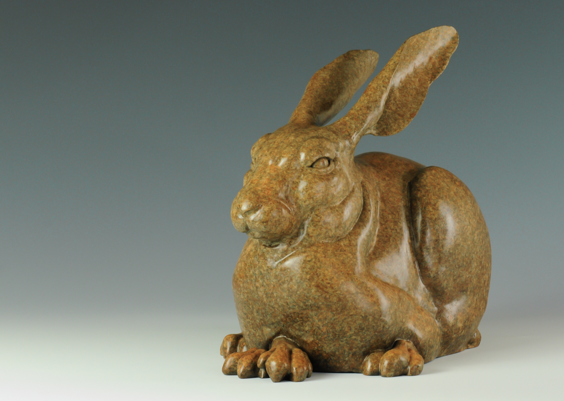 A Fine Art Sculpture In Bronze By Jeremy Bradshaw Featuring A Resting Rabbit, Available At Gallery Wild