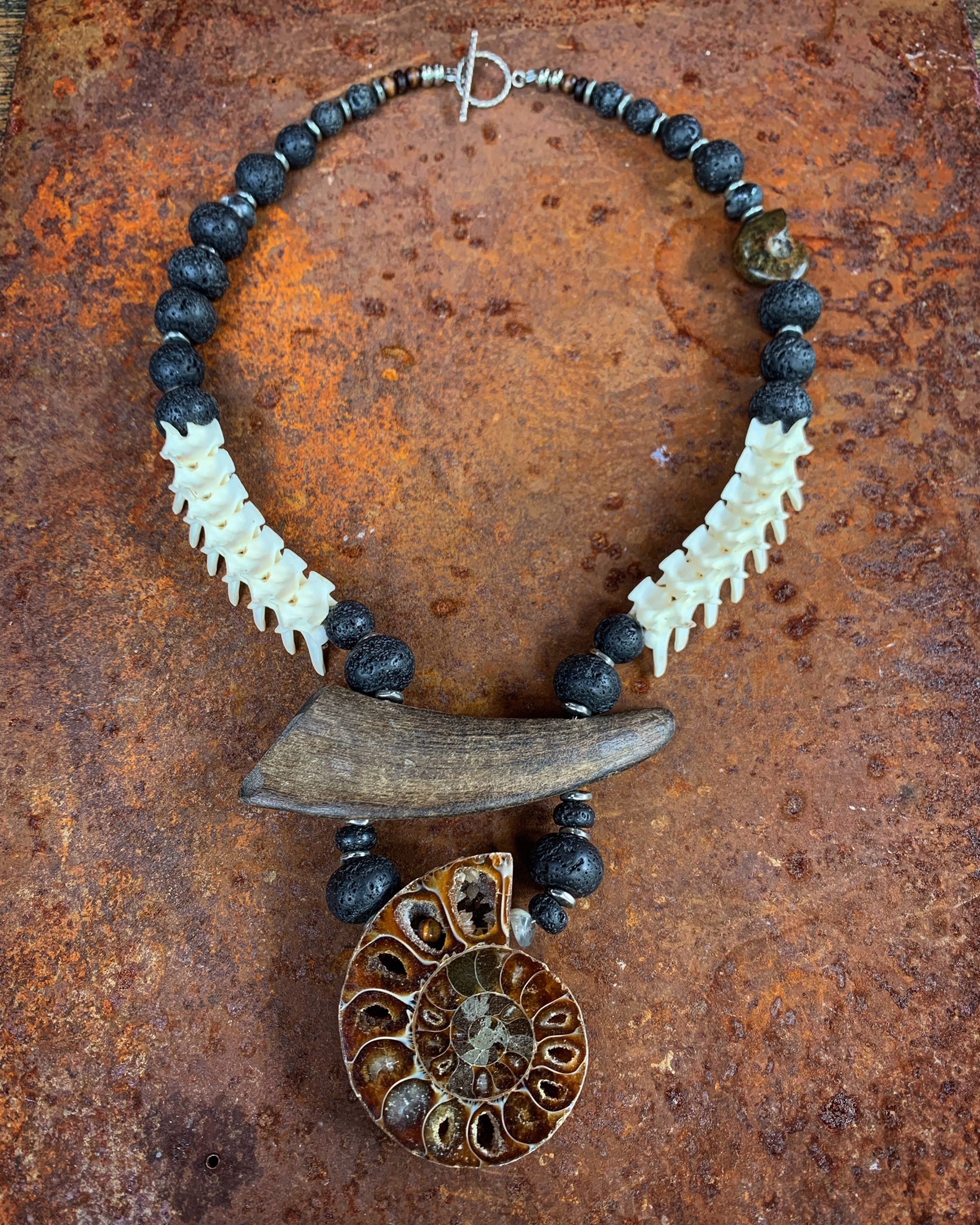 K840 Sufficient Sacrifice Goat Horn, Rattle Snake, Lava, and Ammonite by Kelly Ormsby