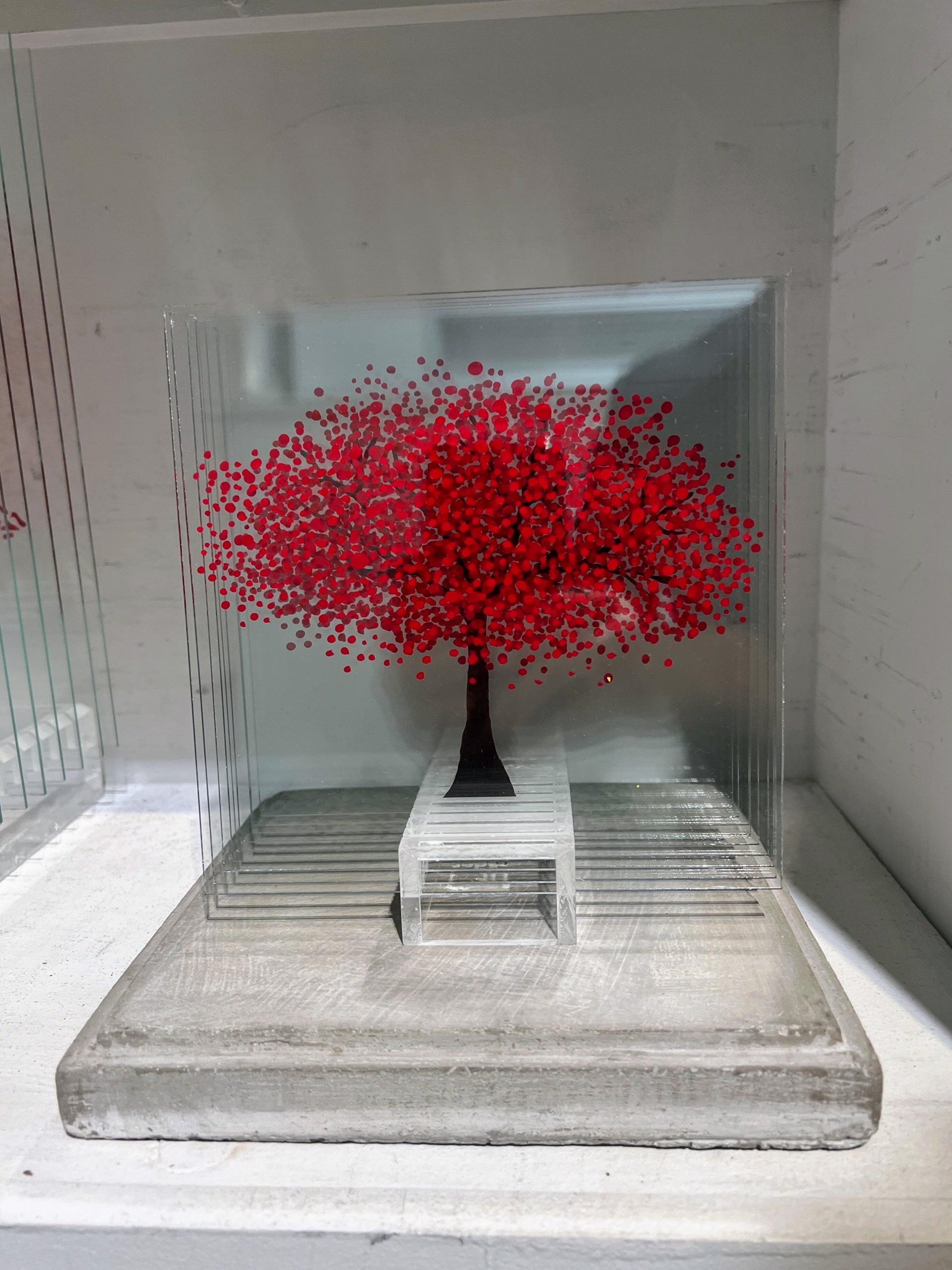 Red Tree on a stand by Ardan Özmenoğlu
