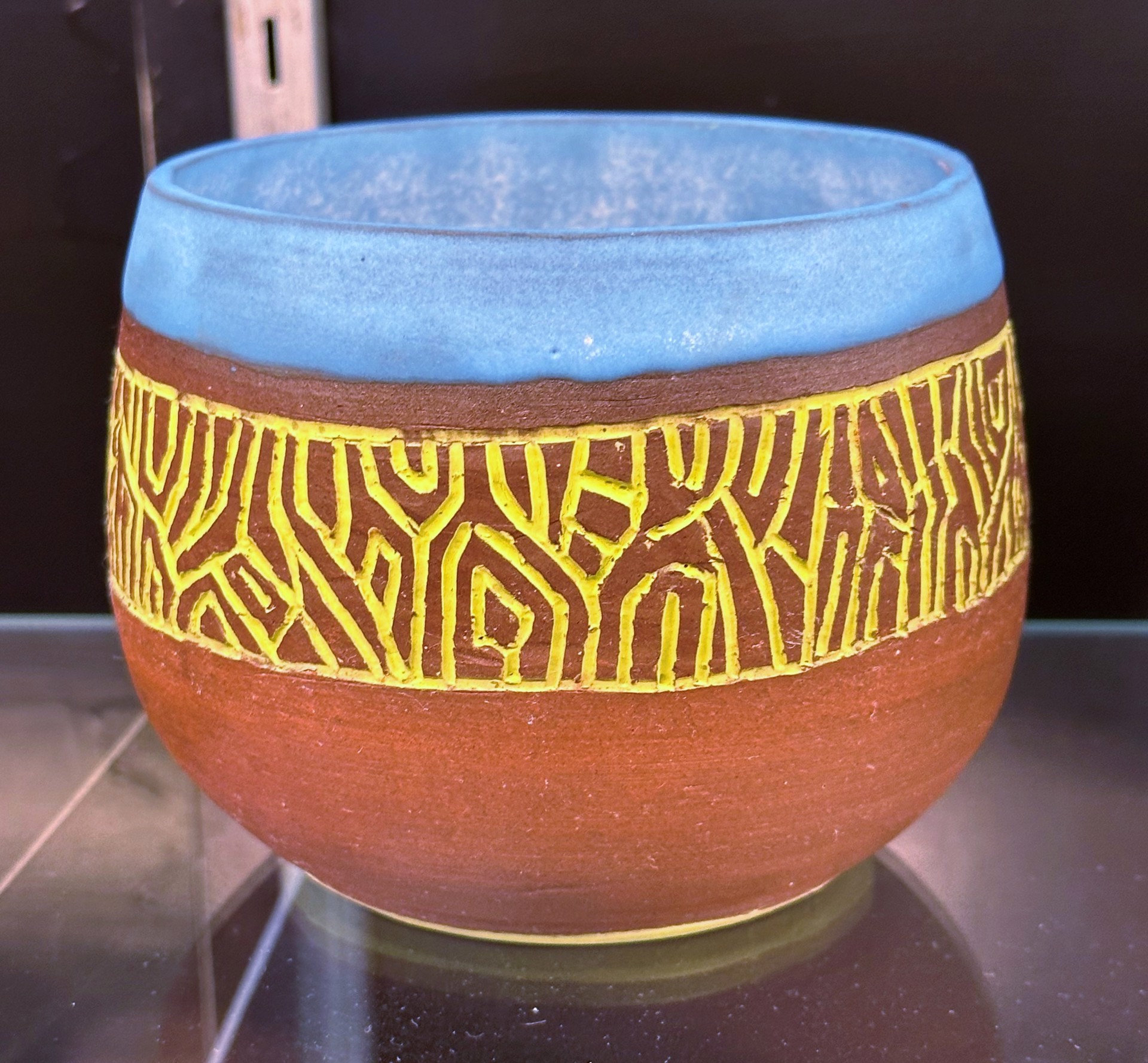 Red clay bowl with chartreuse inlay and blue interior glaze by James Baxter