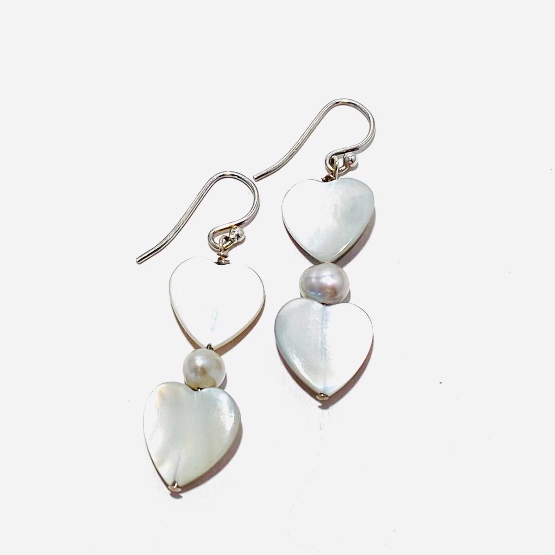 NT22-242  Mother Of Pearl Double Heart Earrings by Nance Trueworthy