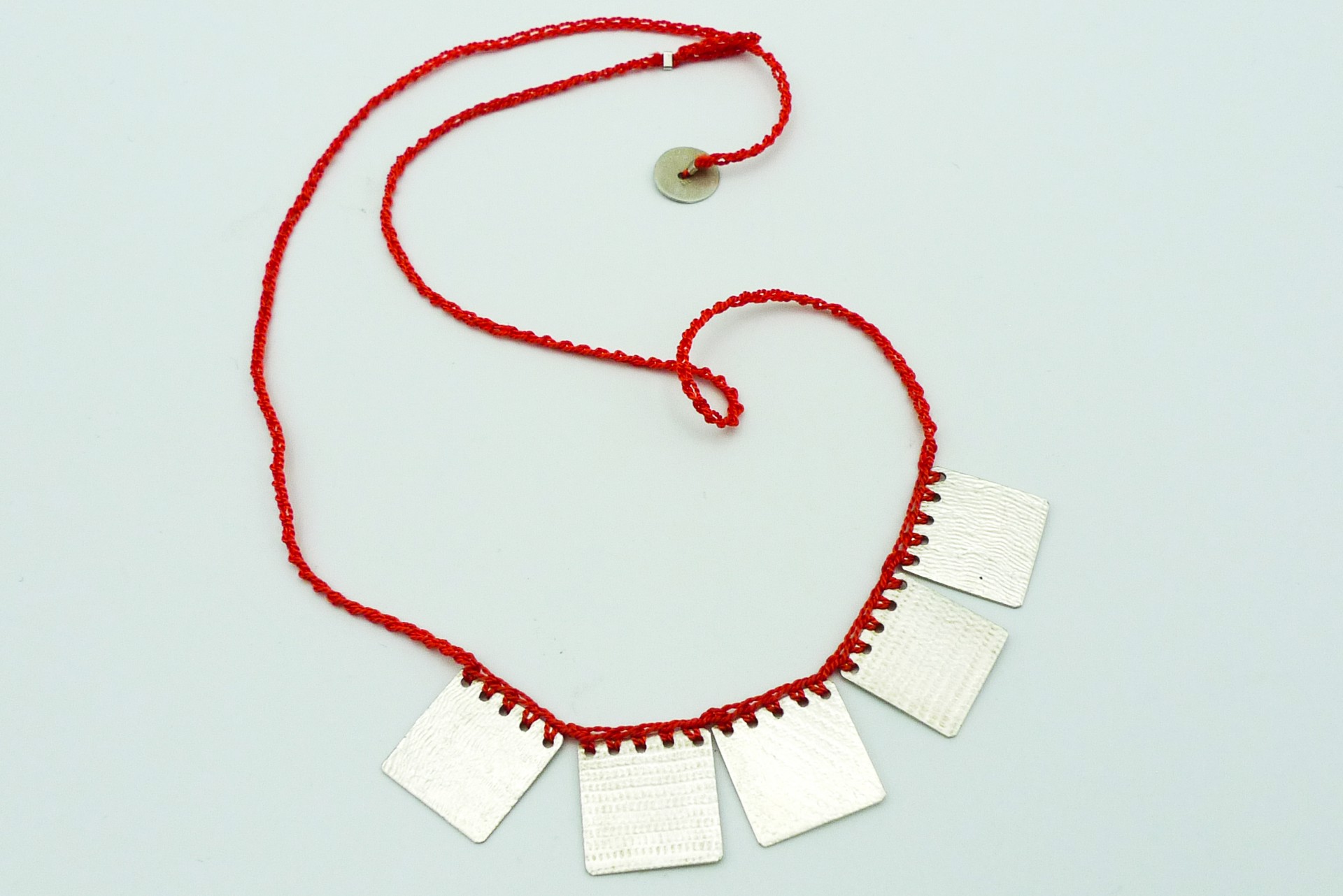 Necklace with Coral Colored Silk Thread by Erica Schlueter