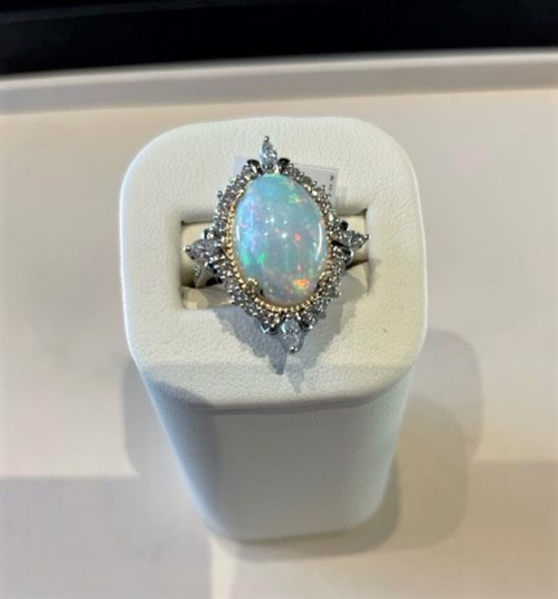 Oval Ethiopian Opal surrounded by diamonds in 18k white gold by Melinda Lawton Jewelry