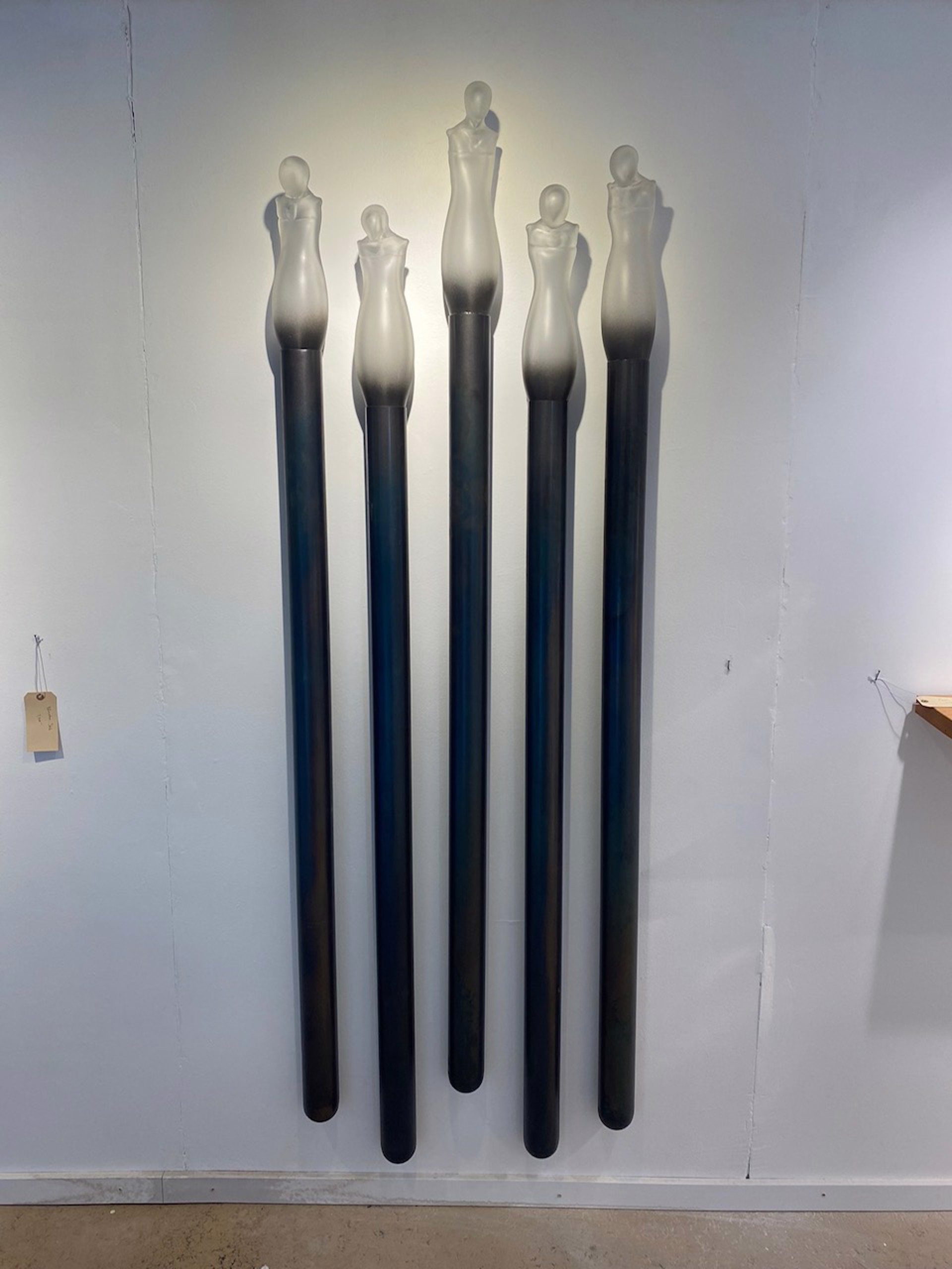 Figurative glass mounted on steel tube by Seth Fairweather