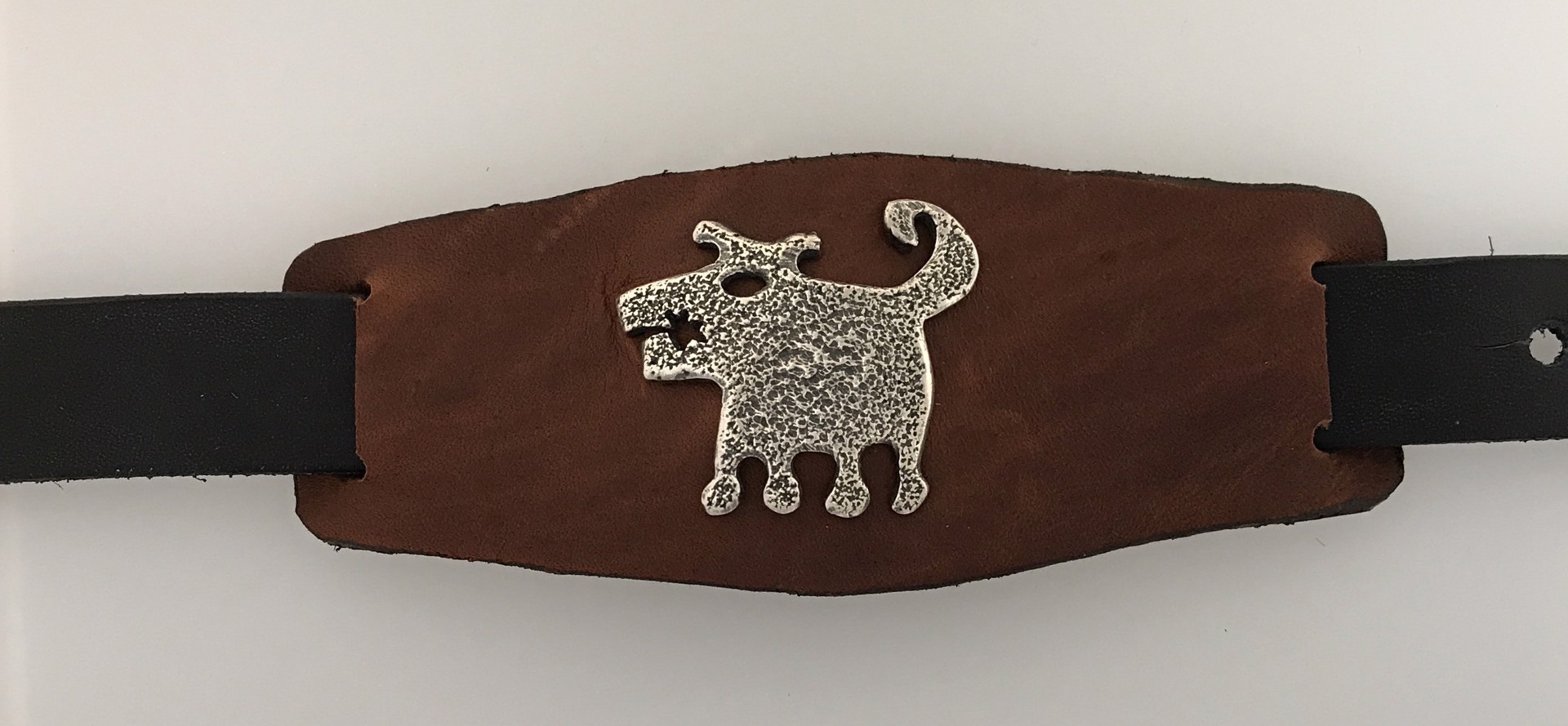 Leather cuff with Silver rez dog by Melanie A. Yazzie