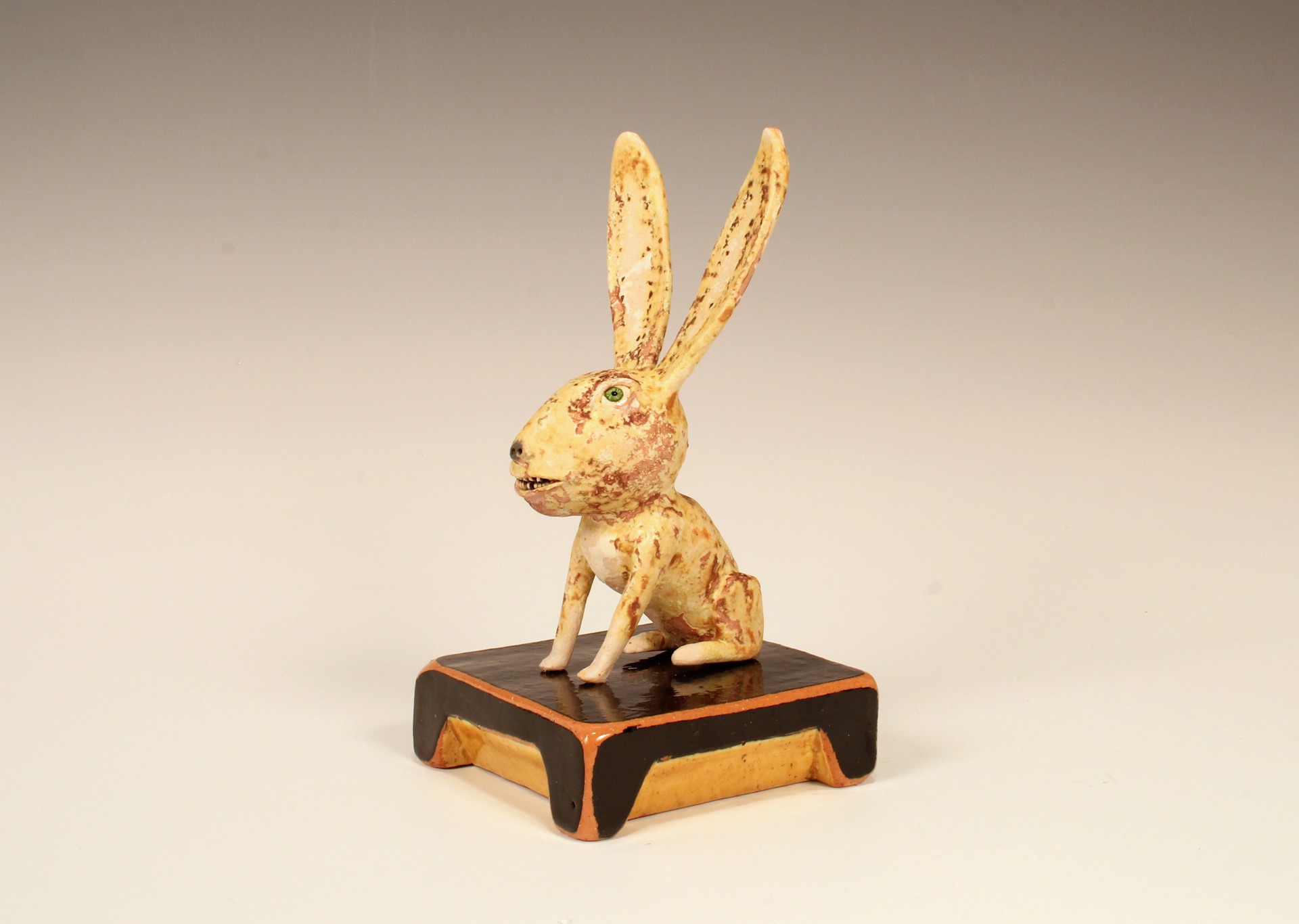 Yellow Rabbit on Black Base by Wesley Anderegg