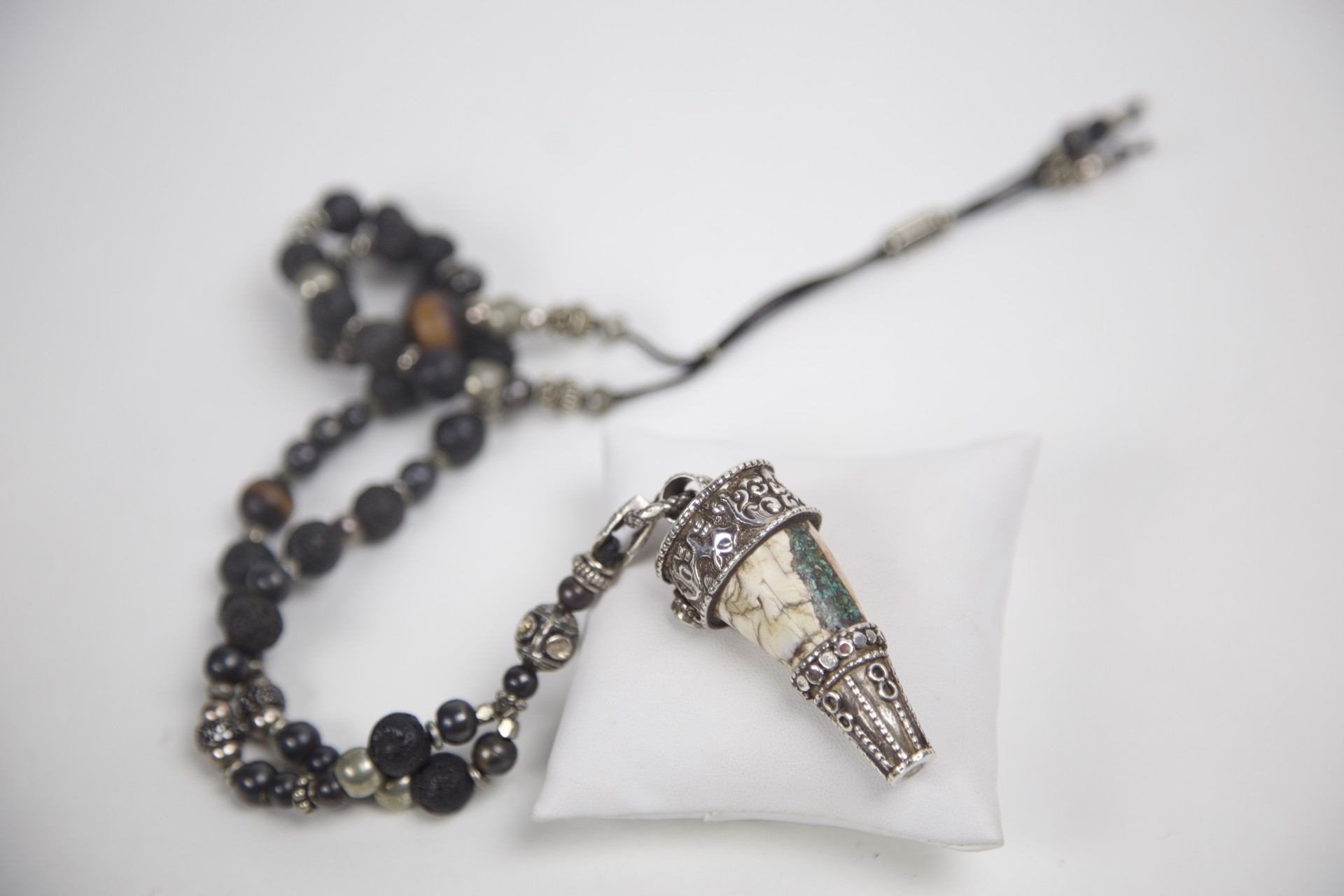 Yak horn necklace with turquoise, diamonds, black pavé spinel beads, lava rock, onyx, wood by Jeri Mitrani