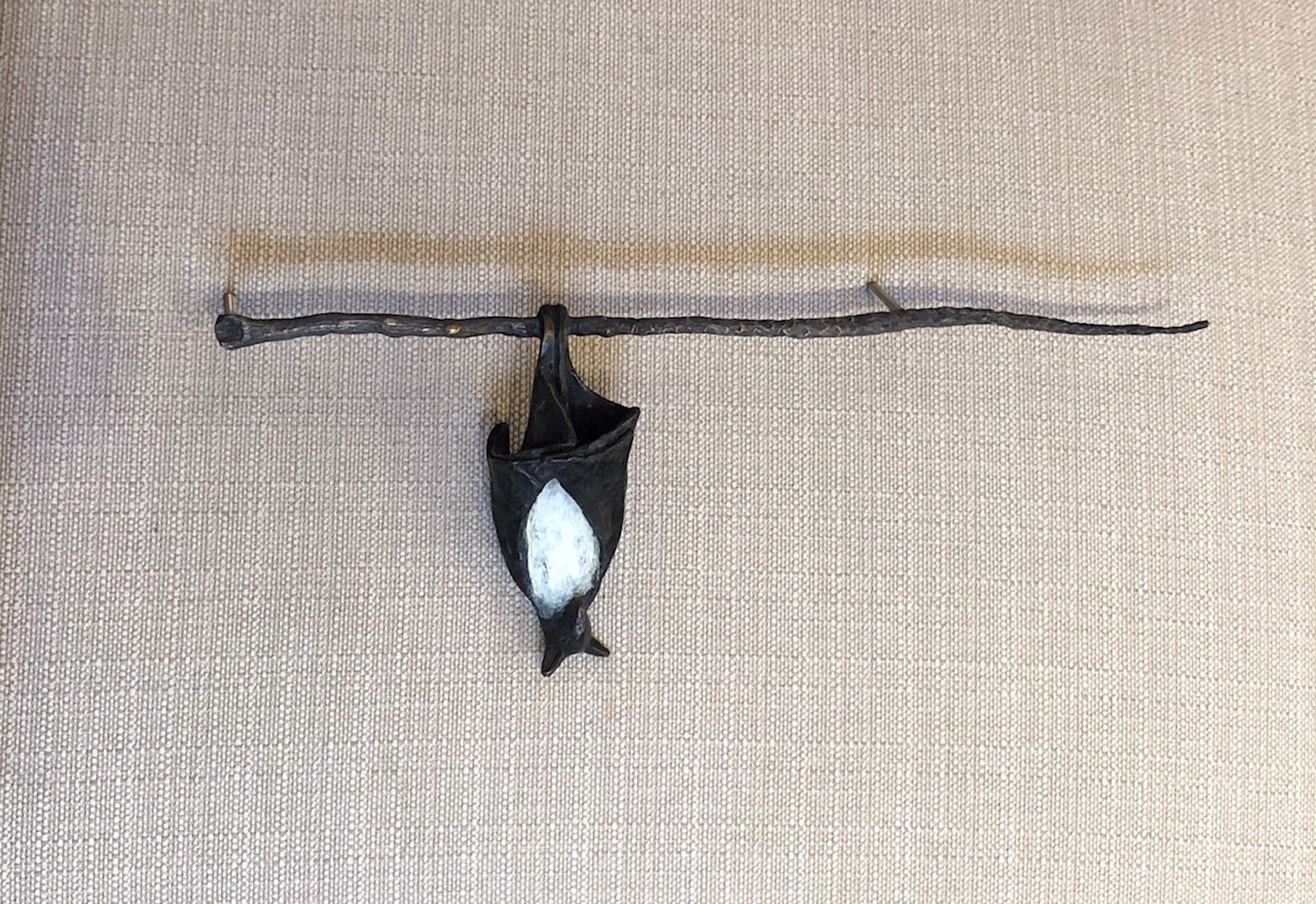 1 Temple Bat on a Branch, hangs from the left side by Copper Tritscheller