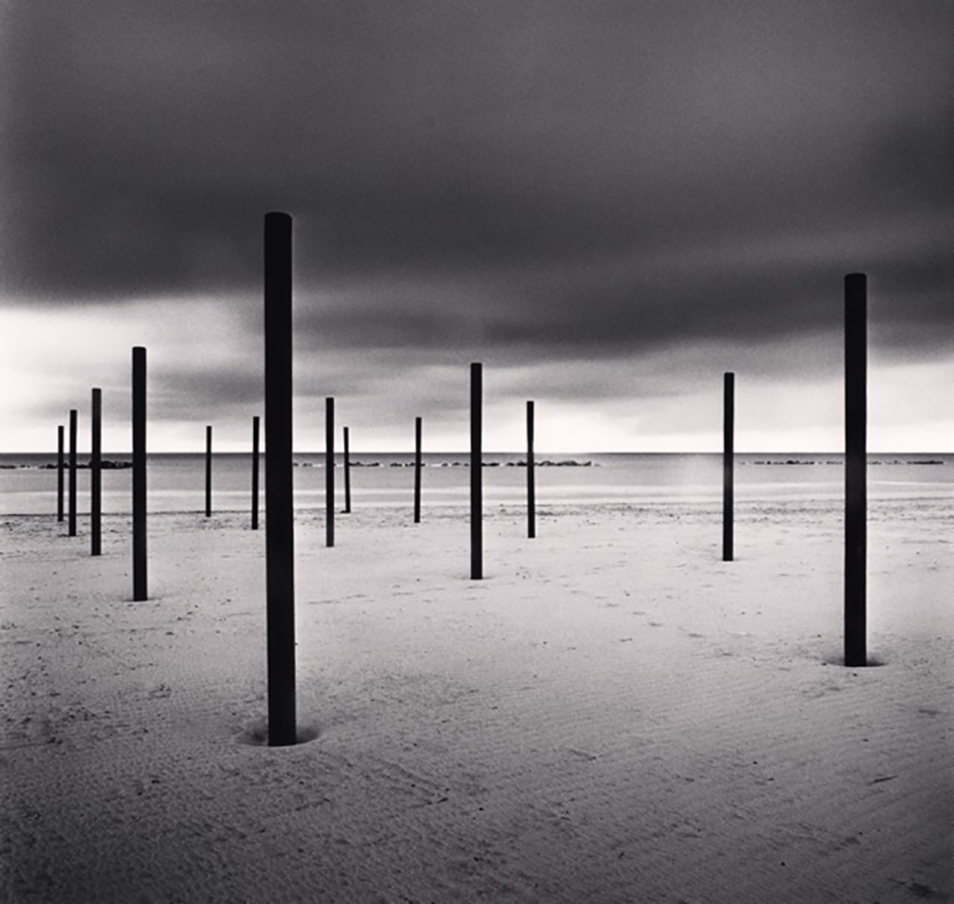 Fourteen Beach Poles, Pescara, Abruzzo, Italy (edition of 25) by Michael Kenna
