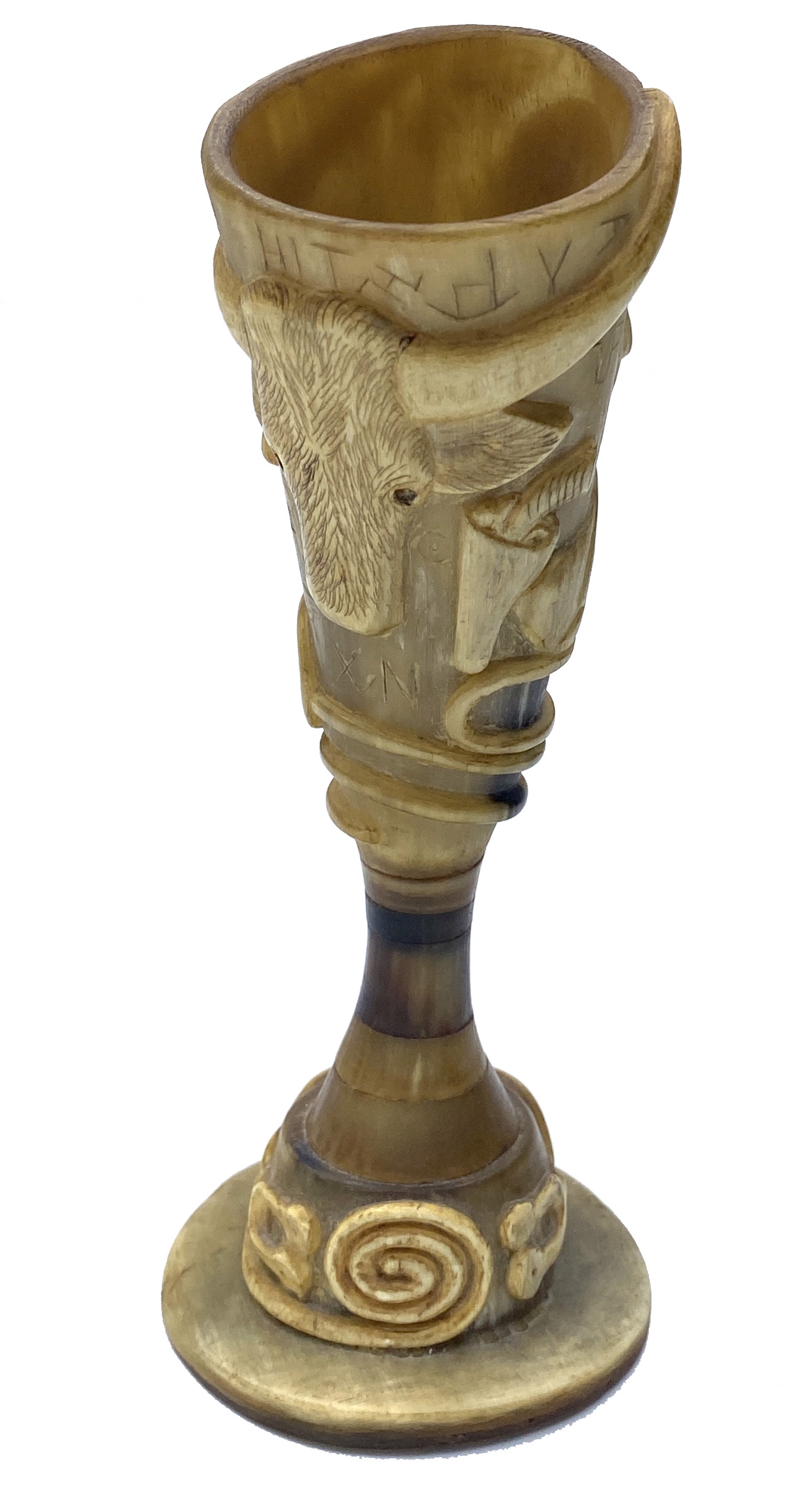 DS-80: carved horn drinking cup on stand; portrait of artist, carved ranching emblems, longhorn, saddle, riding gear, gun in holster; around base - "Texas" with image of spurs and rope; horn inlay at neck by Dan Super