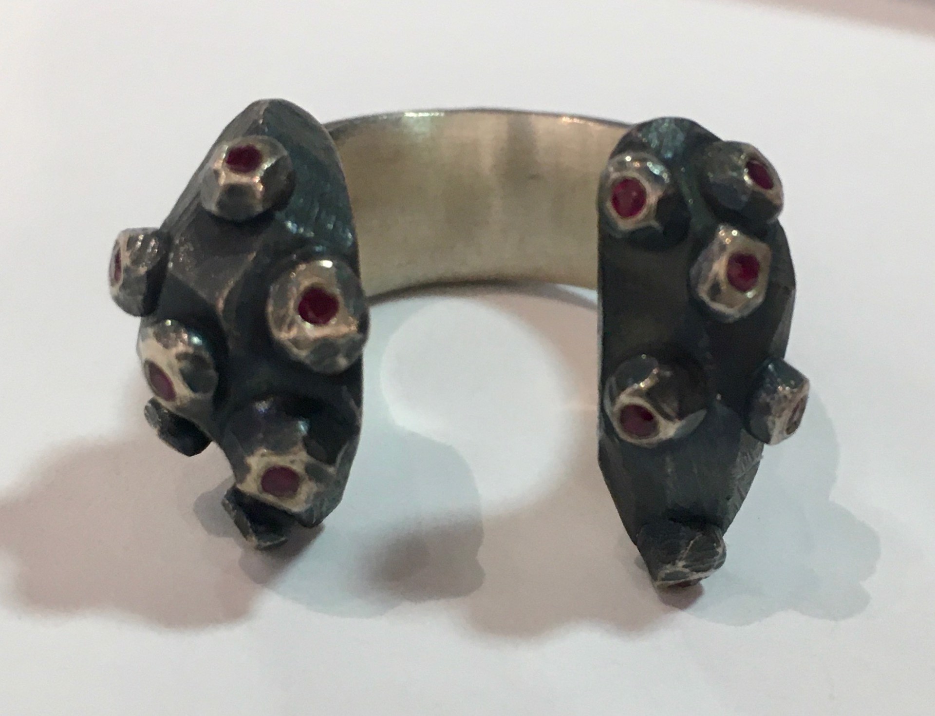 Oxidized Silver Split Ring with Rubies  by DAHLIA KANNER