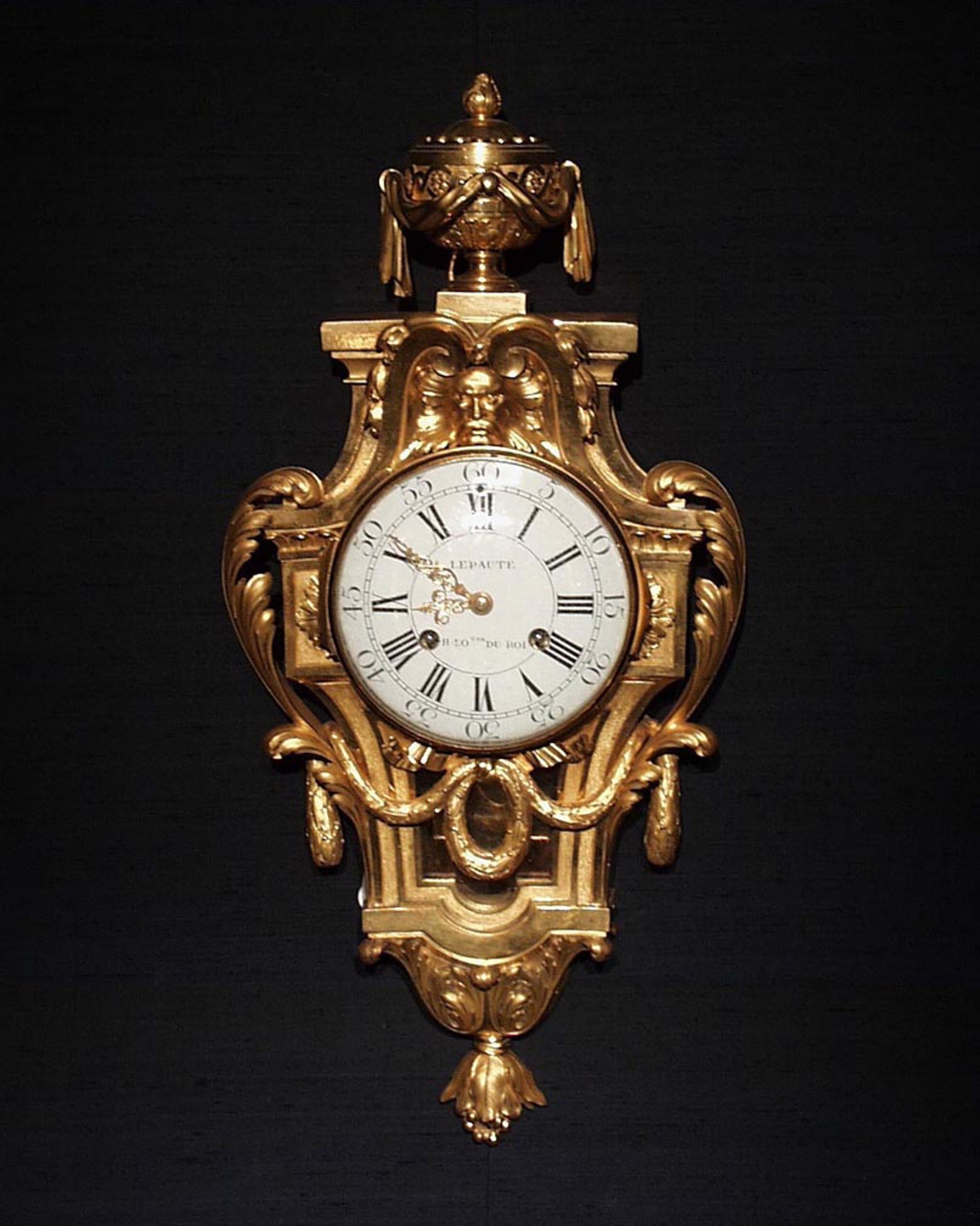 LOUIS XVI BRONZE CARTEL CLOCK WITH MASK AND GARLANDS BY LEPAUTE by Jean-Andre Lepaute