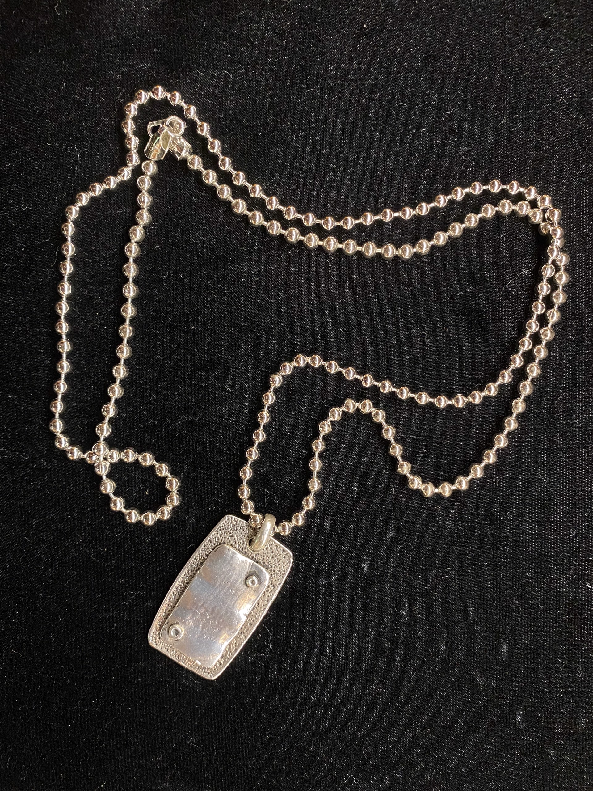 Sterling silver dog tag necklace by Jeri Mitrani