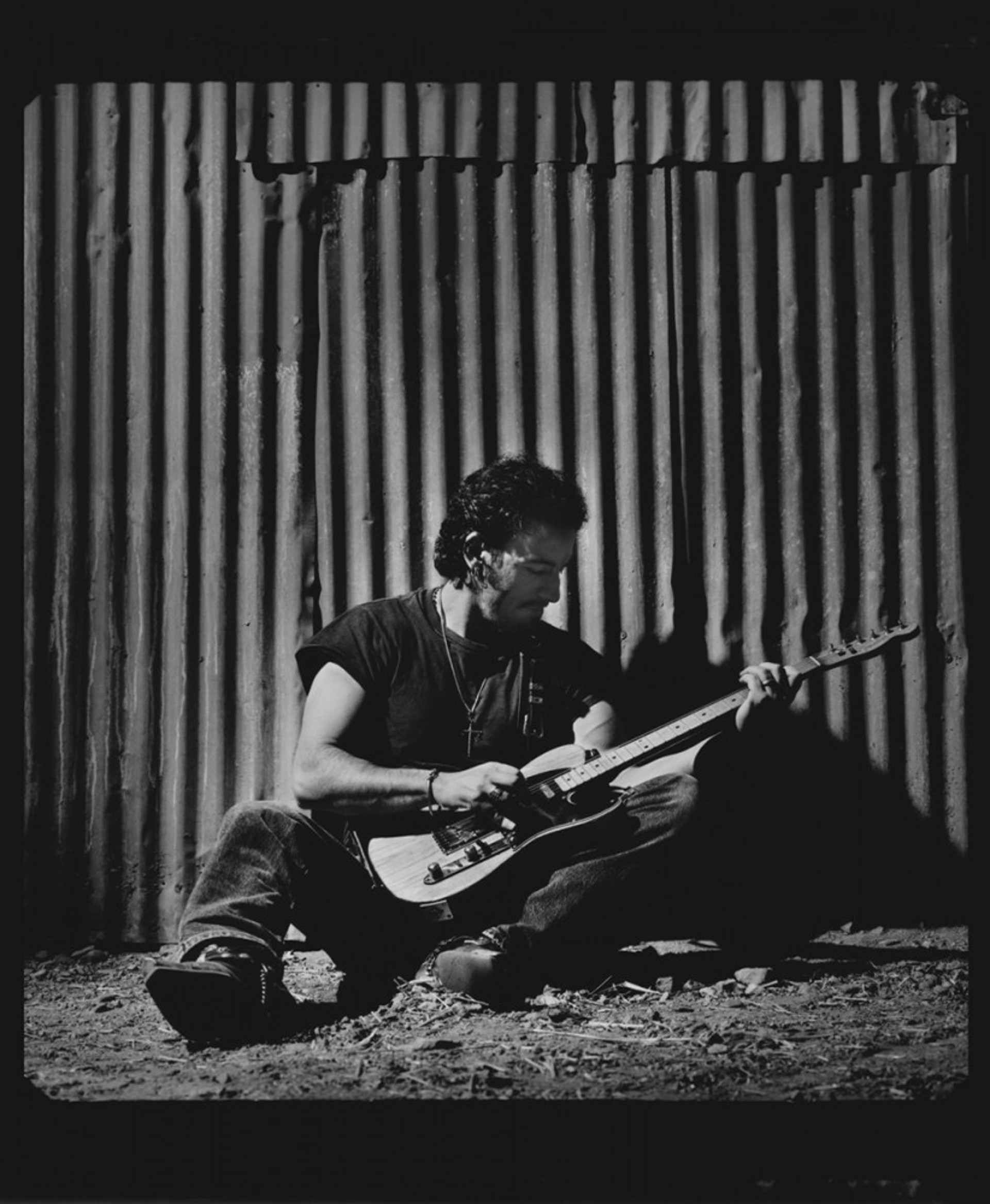 91152 Bruce Springsteen Seated on Corrugated Wall BW by Timothy White