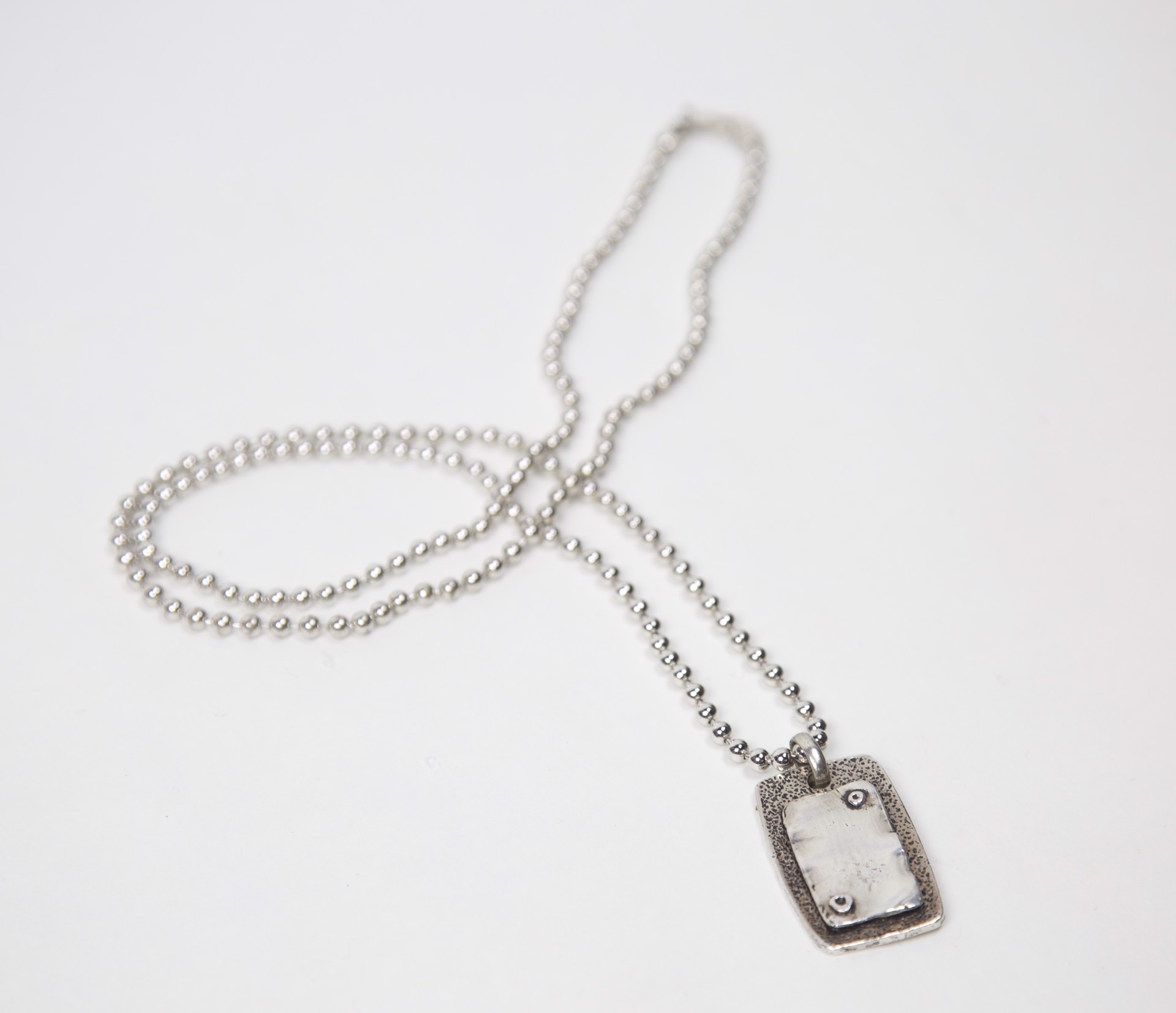 Sterling silver dog tag necklace by Jeri Mitrani