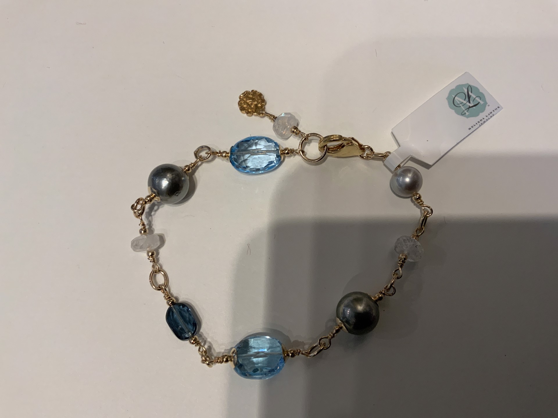 Tahitian Pearls, Swiss Blue Topaz, Moonstone, and London Blue Topaz by Melinda Lawton Jewelry