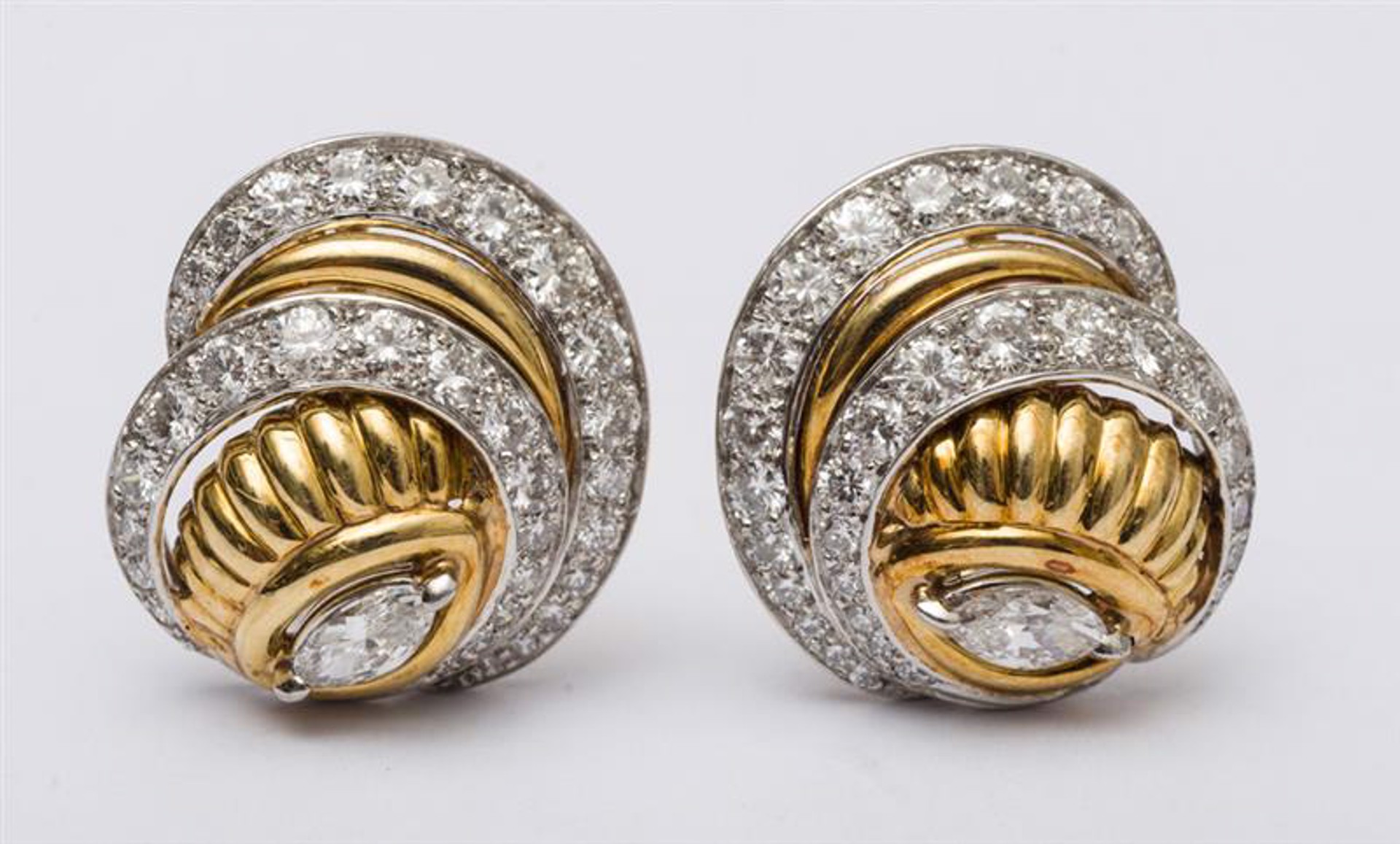PAIR OF YELLOW GOLD AND PLATINUM SWIRL EARRINGS