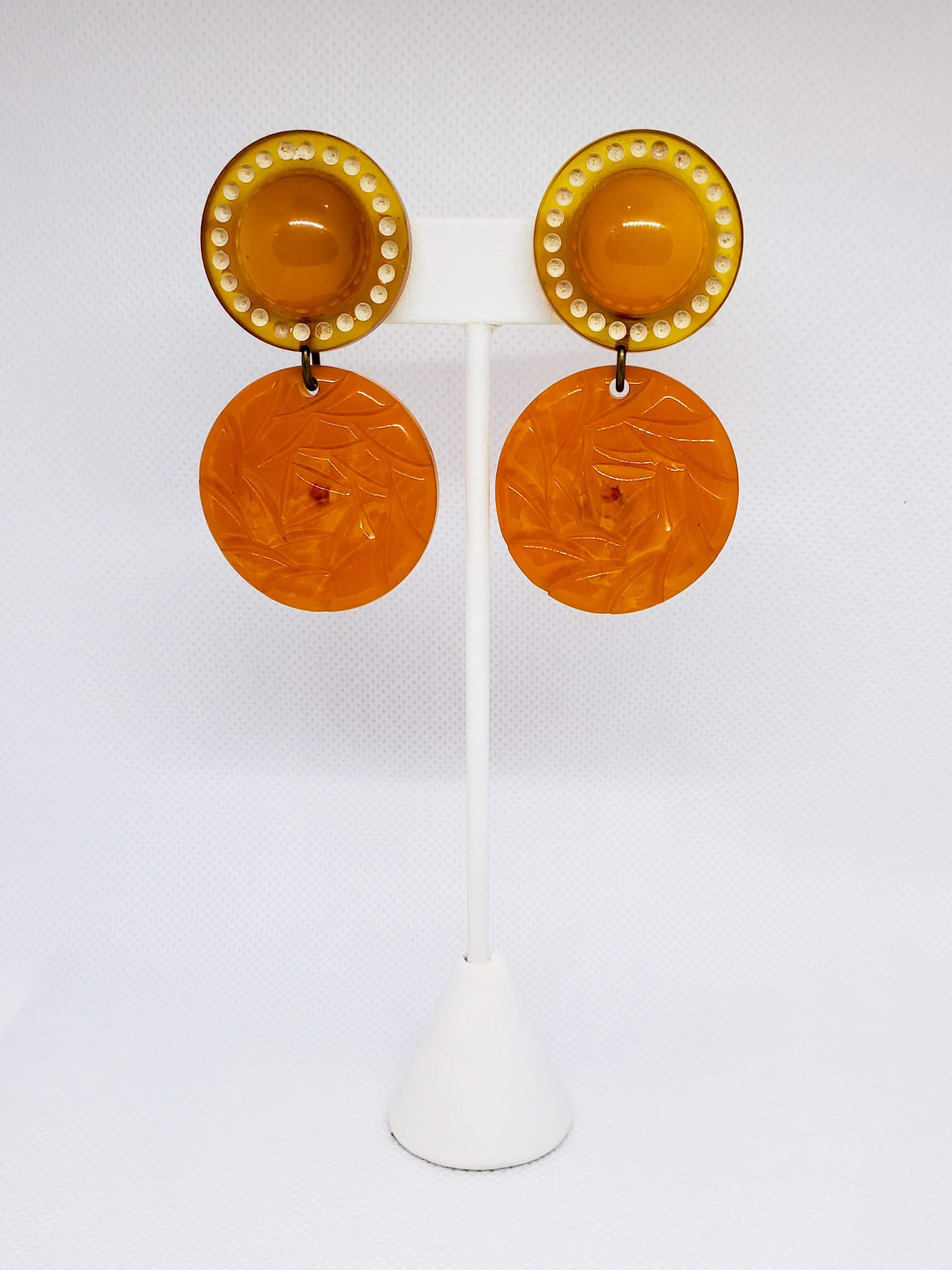 Yellow Bakelite with Carved Circles Underneath by Sally Bass