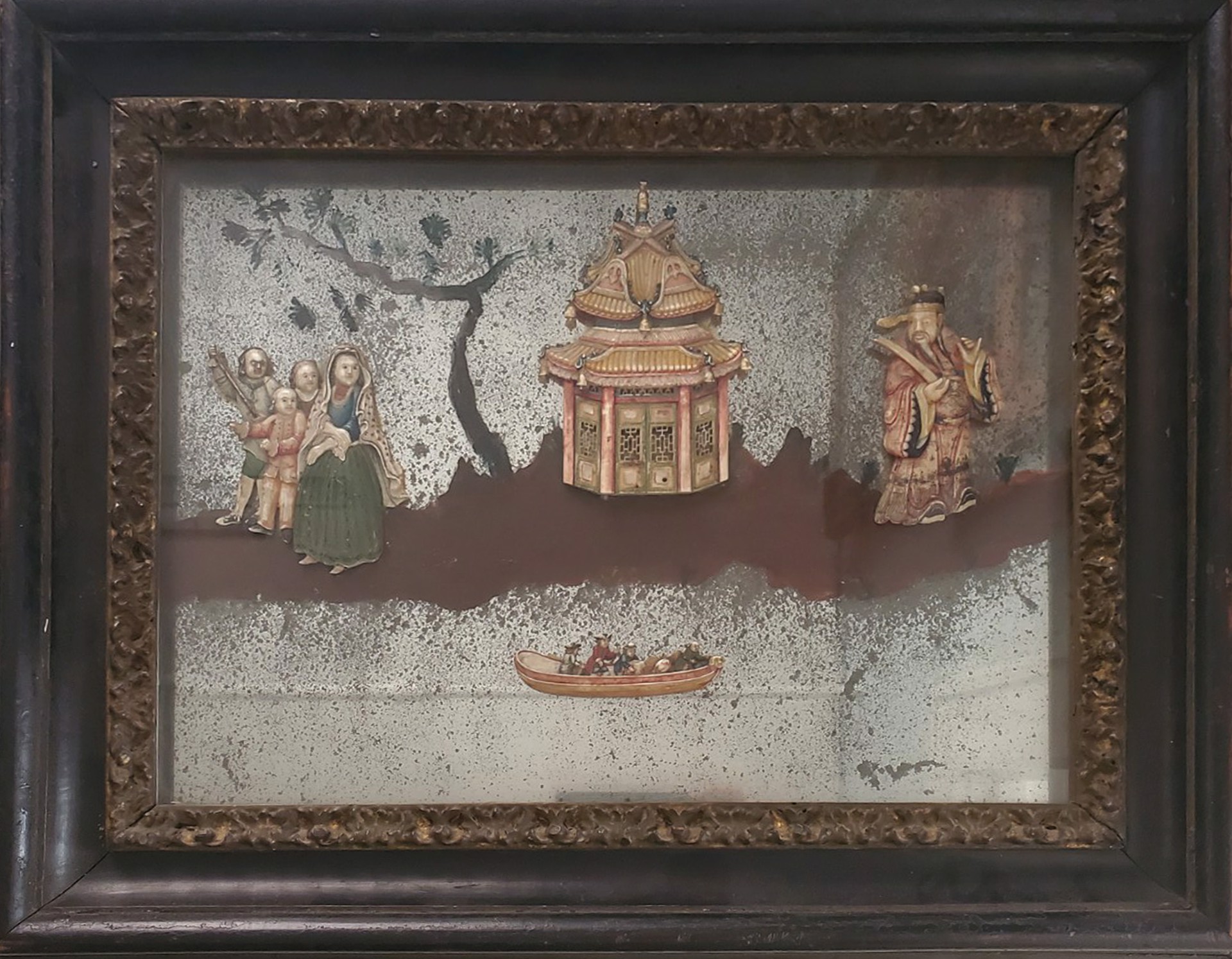 A PAINTED AND APPLIQUE MIRROR WITH FIGURES, PAGODA IN ISLAND LANDSCAPE