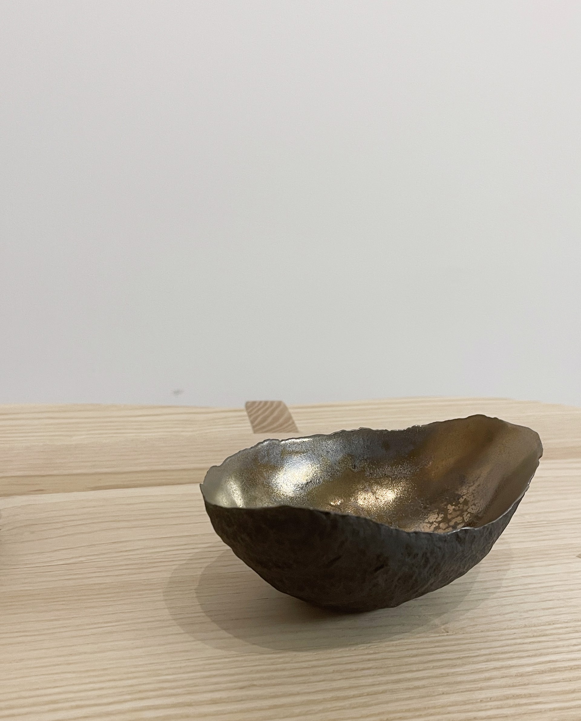Small vessel with textured bronze glaze by Cristina Salusti
