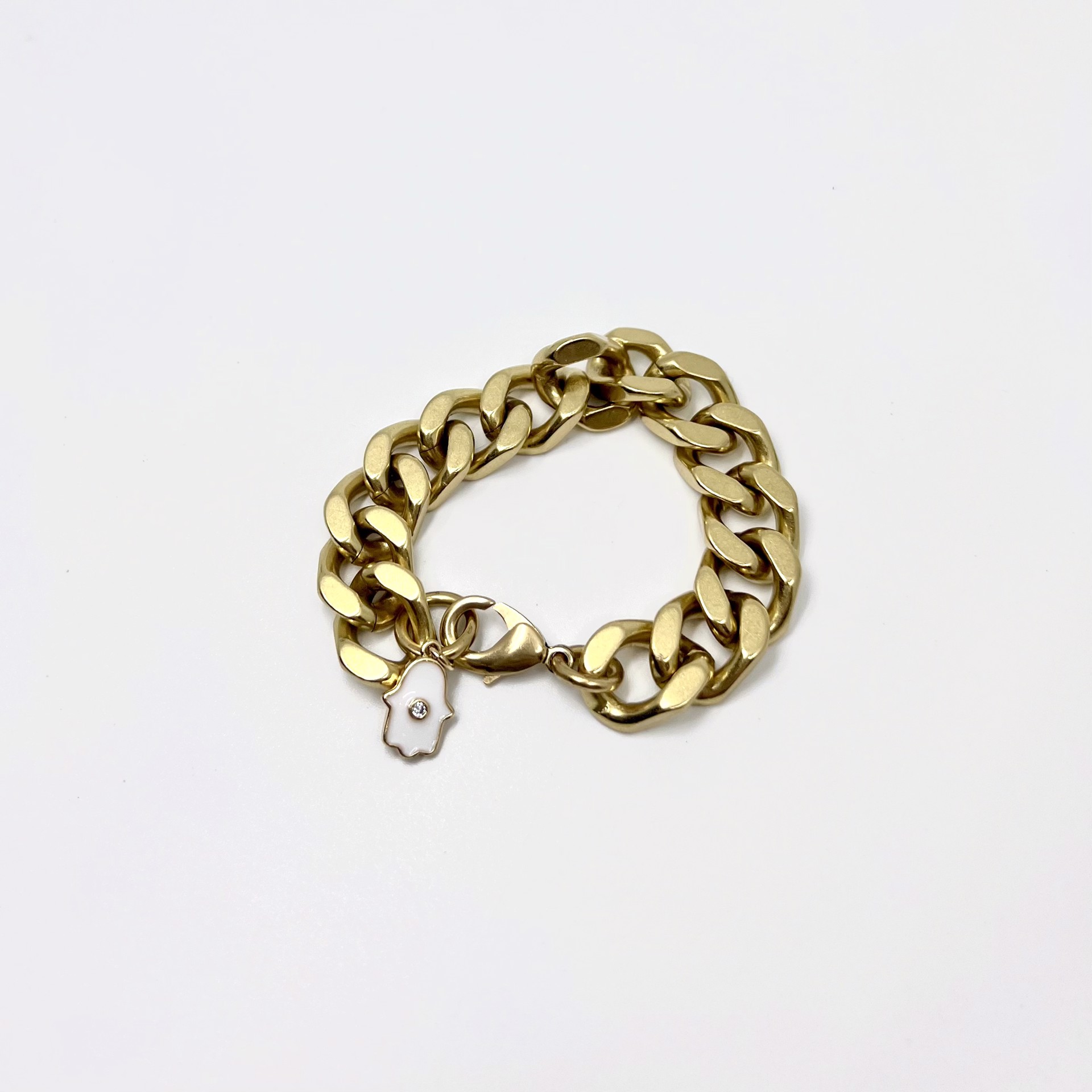 Chain: Thick Curb 4.0 & Hamsa by Rachel Nathan