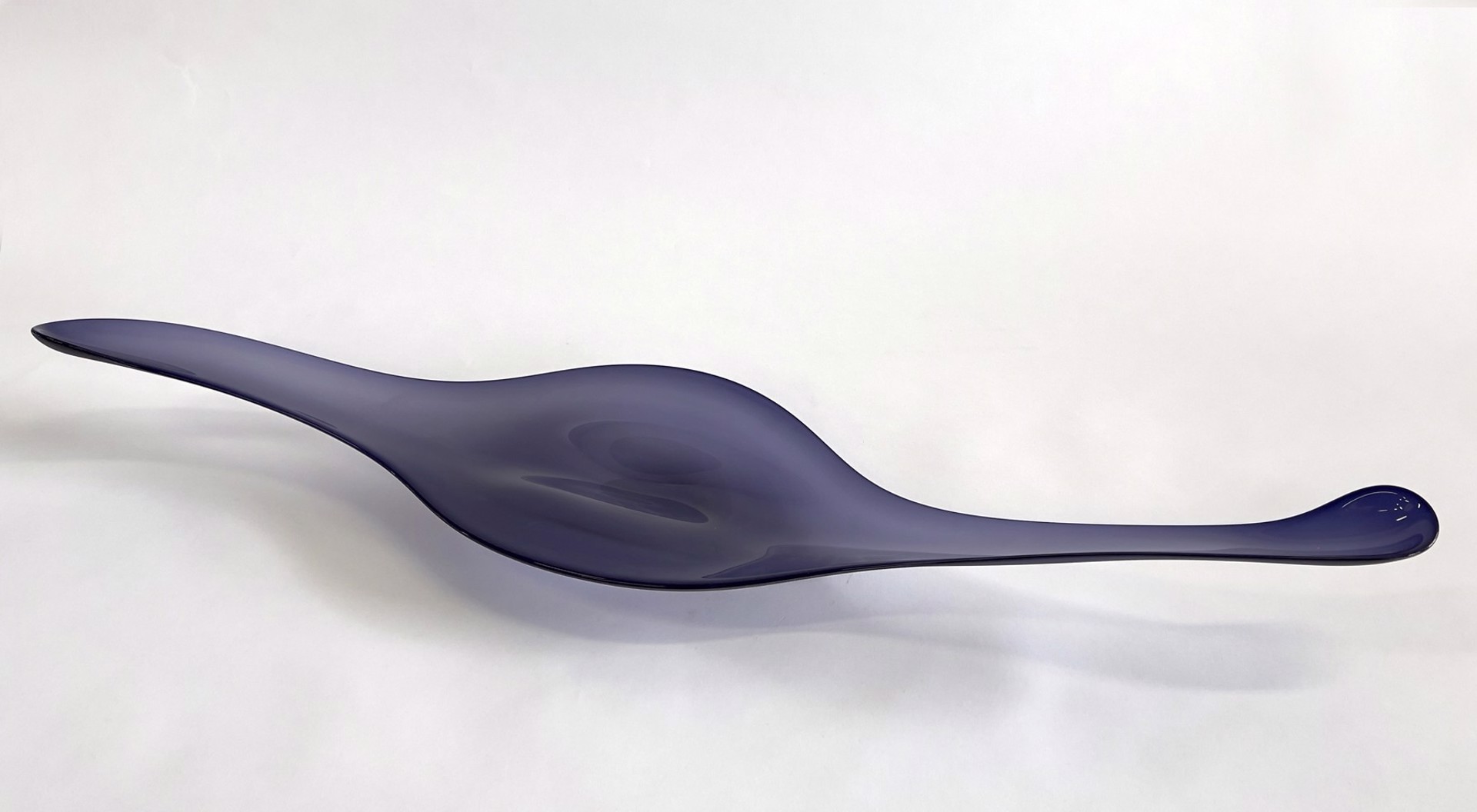 Midnight Camber by The Goodman Studio is a deep purple elongated abstract form. Perfect for a table. 