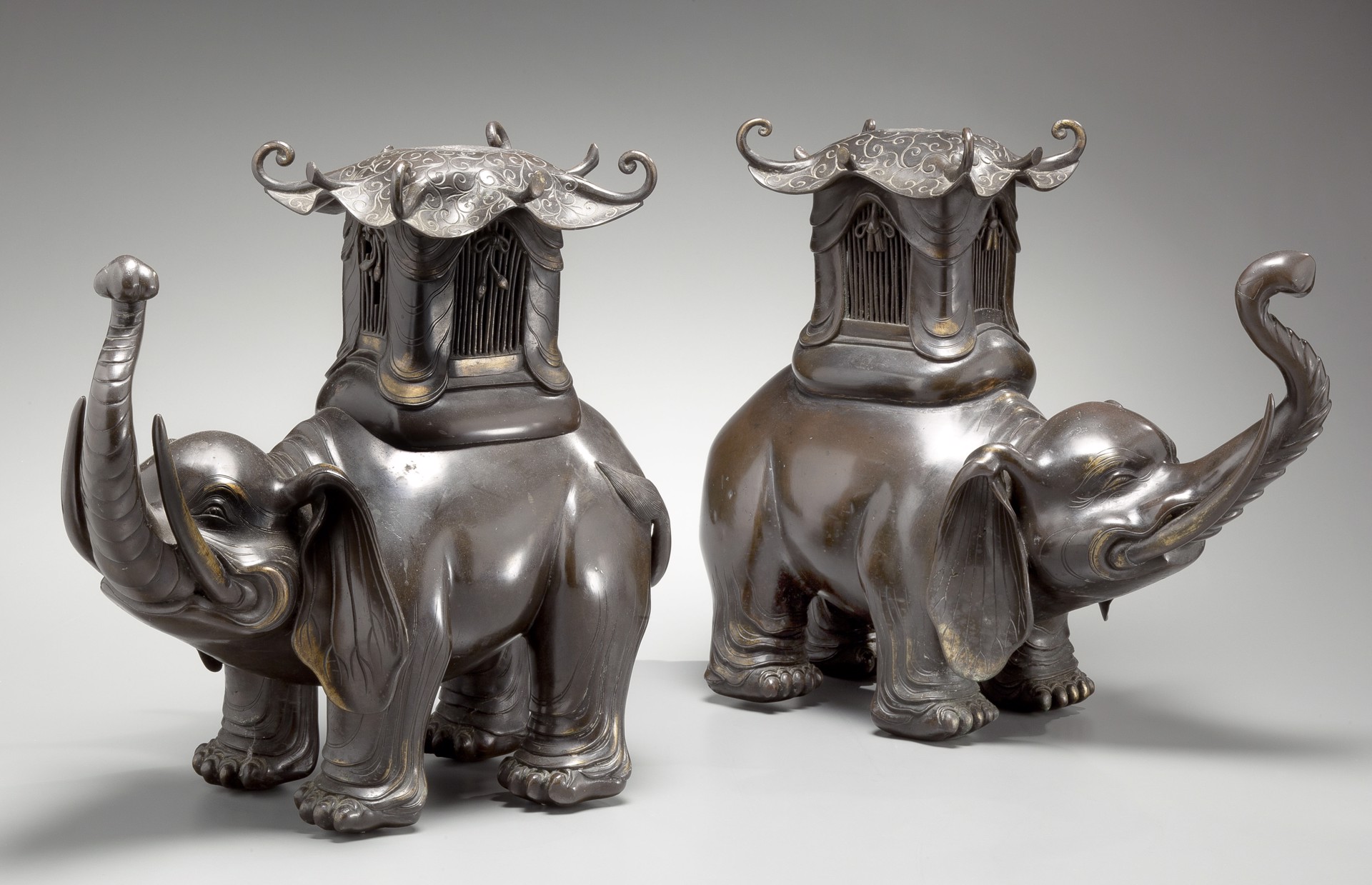 COMPANION PAIR OF JAPANESE BRONZE LAMPS IN THE FORMS OF ELEPHANTS