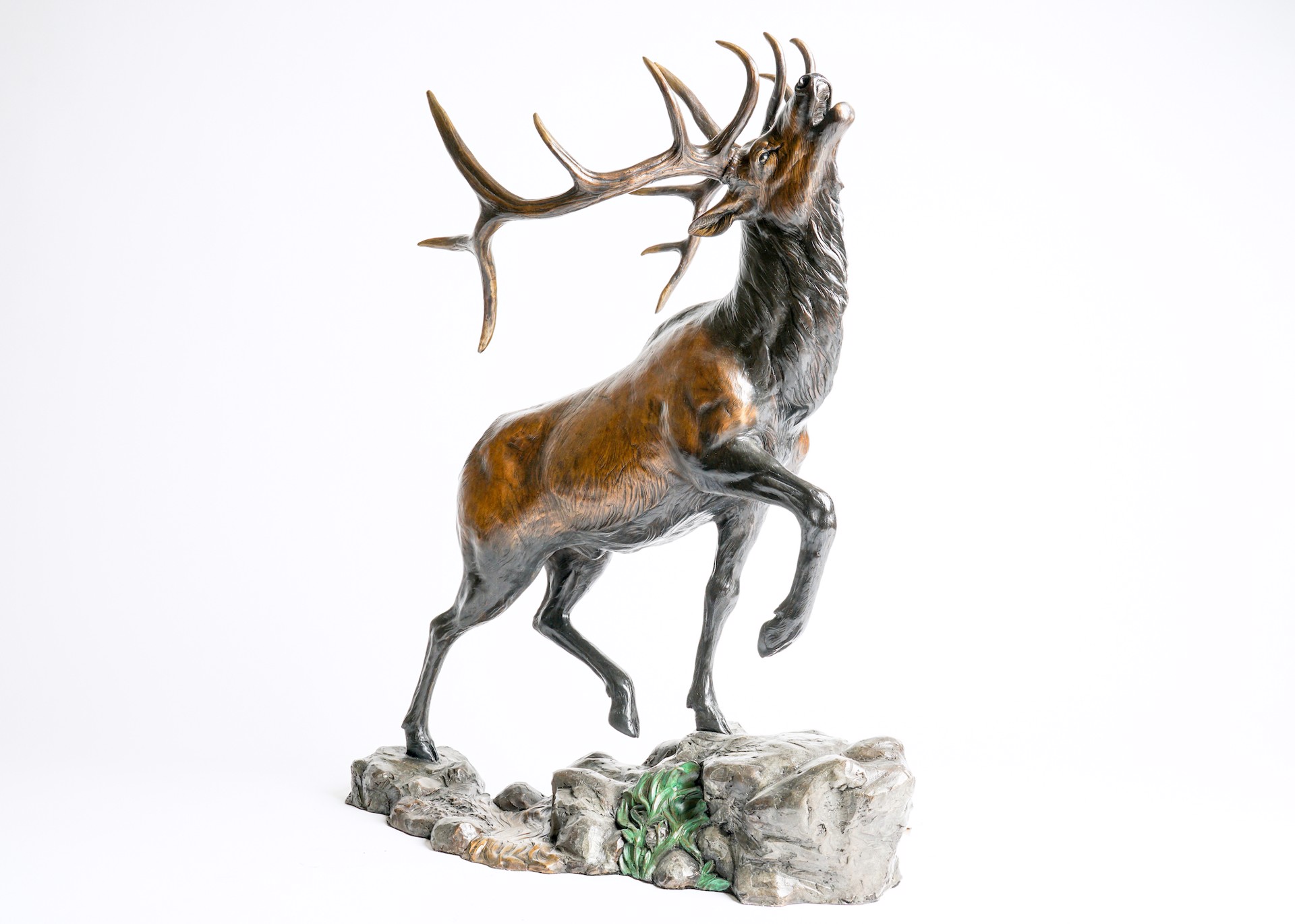 A Bronze Sculpture Of A Bull Elk With Large Antlers Bugling With Head Up Mid Step, By Rip And Alison Caswell