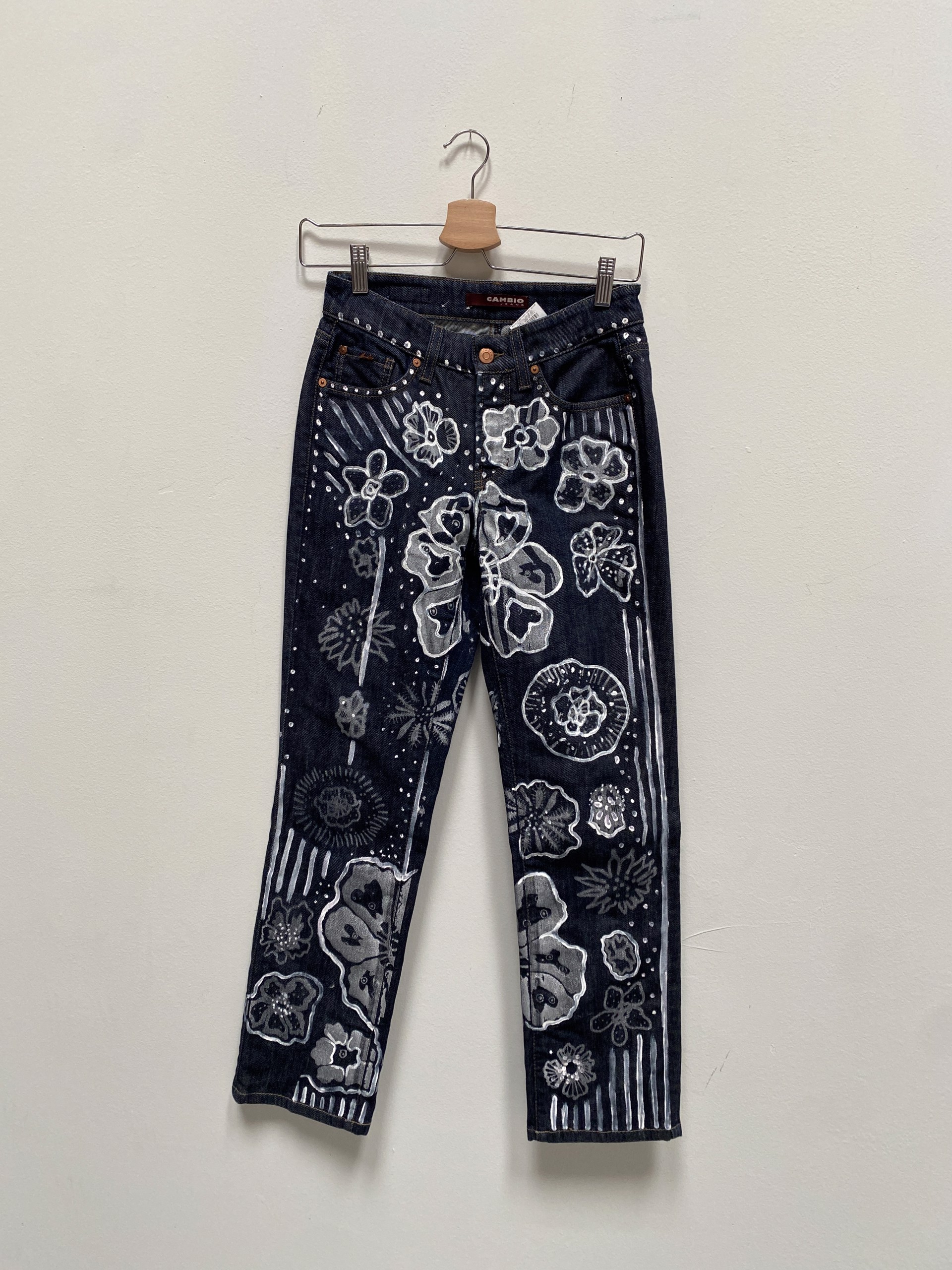 Silver Flowers on Navy Jeans by Laurie Shapiro