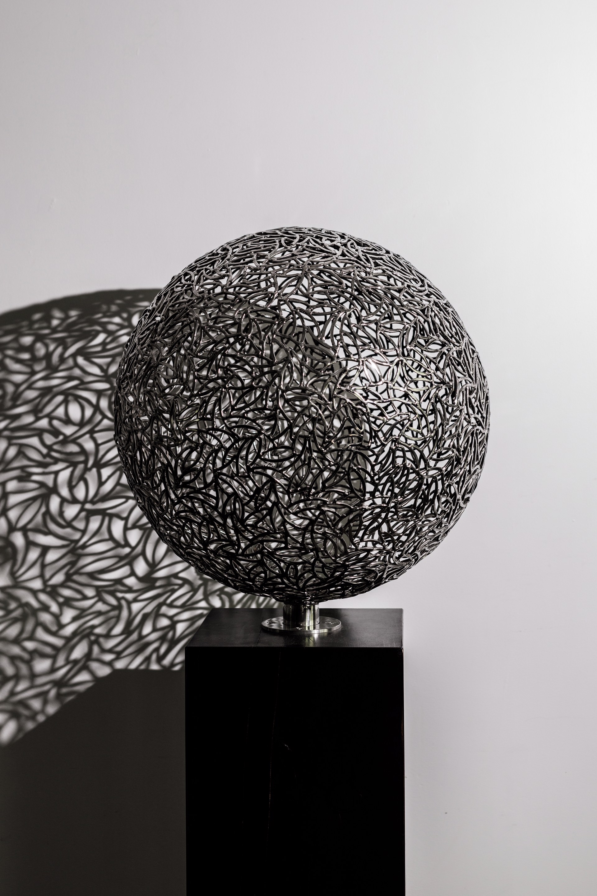 Stainless steel sphere by Lachlan Ross