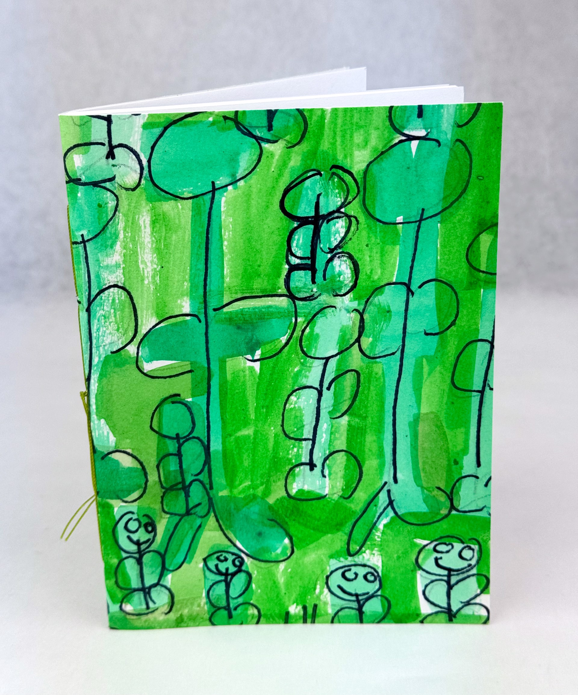 Green with 5 Smiling Flowers (notebook) by Helen Lewis