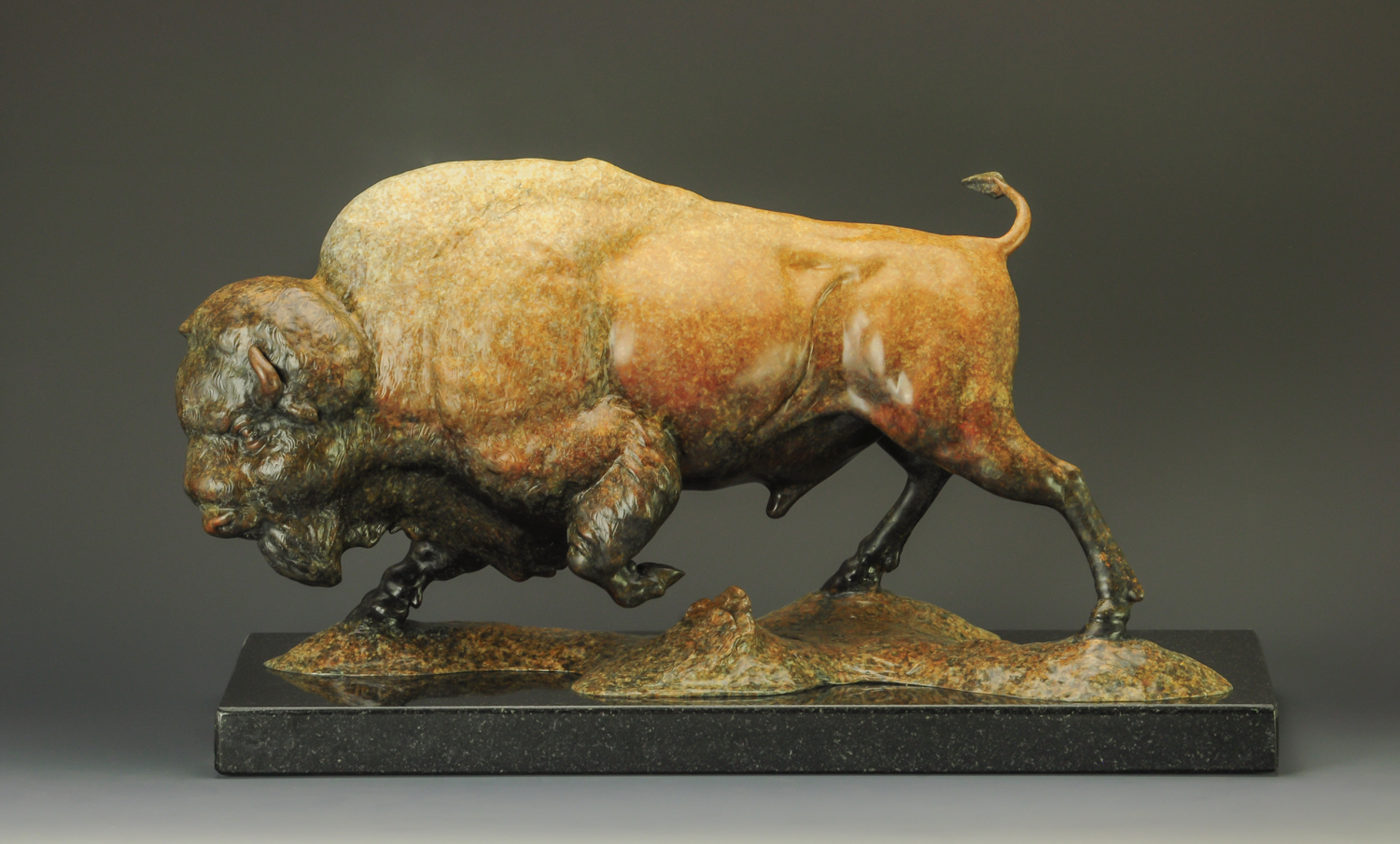A Fine Art Sculpture In Bronze By Jeremy Bradshaw Featuring A Charging Bison, Available At Gallery Wild