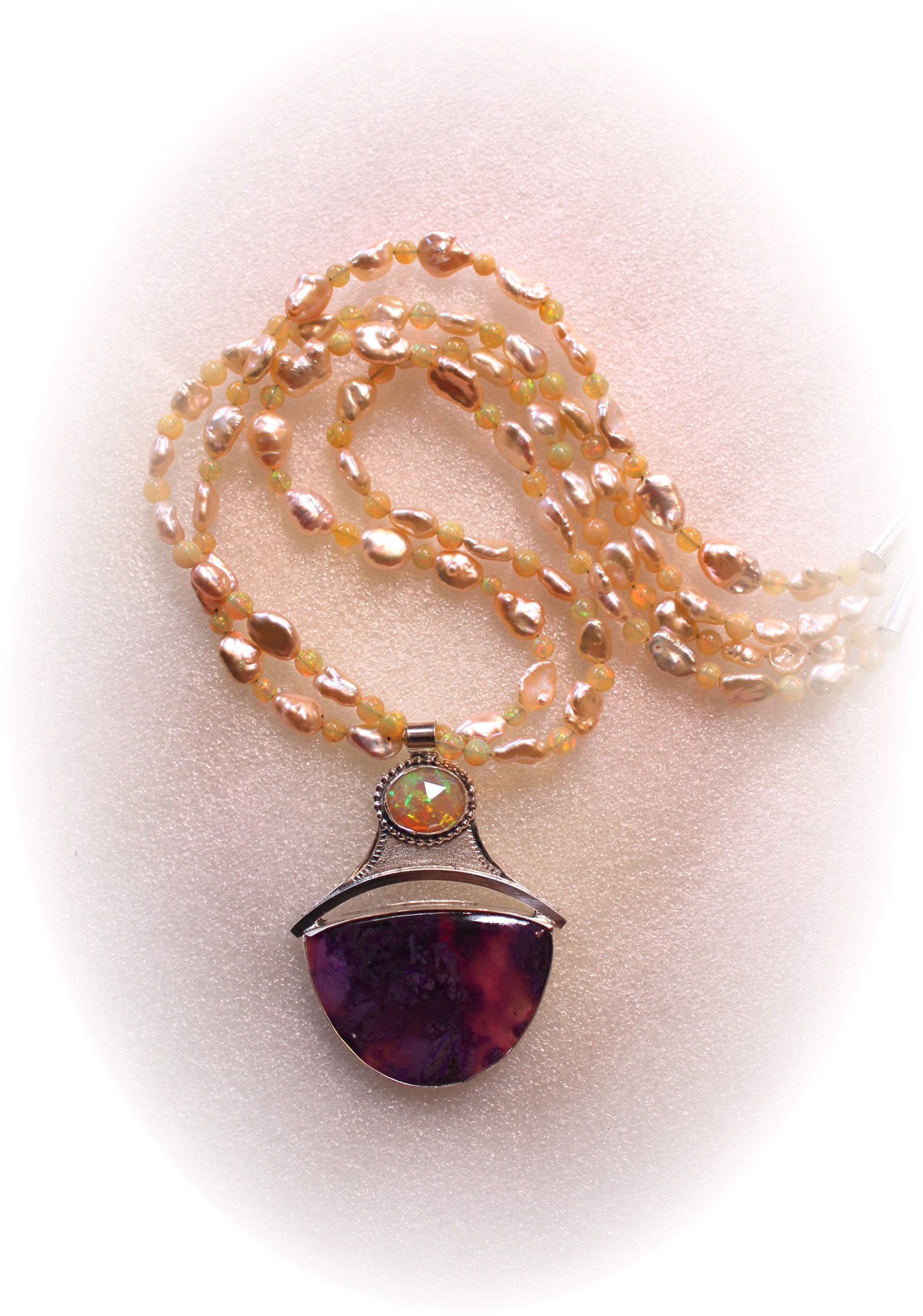 Sugilite in Sterling Silver w/ Opal on peach Pearl strand  by Michael Redhawk