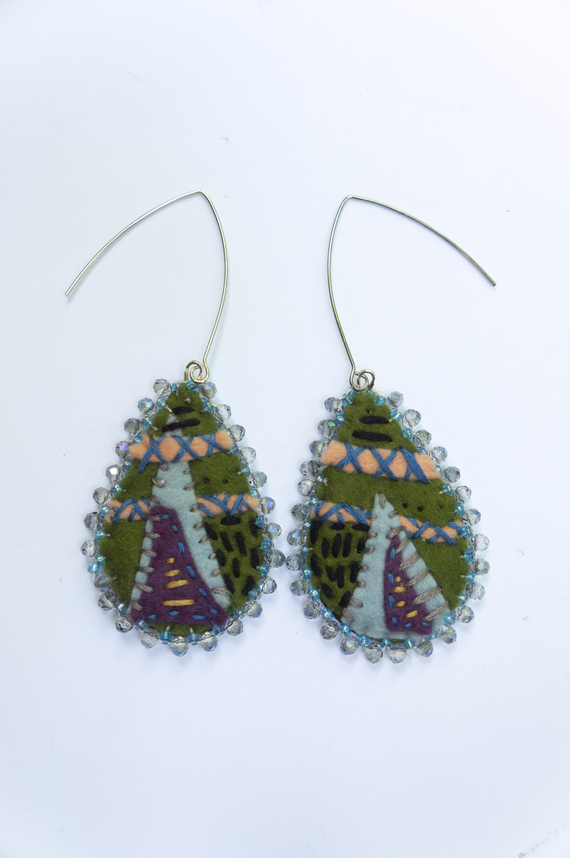 Green, blue edged, embroidered earrings by Hattie Lee