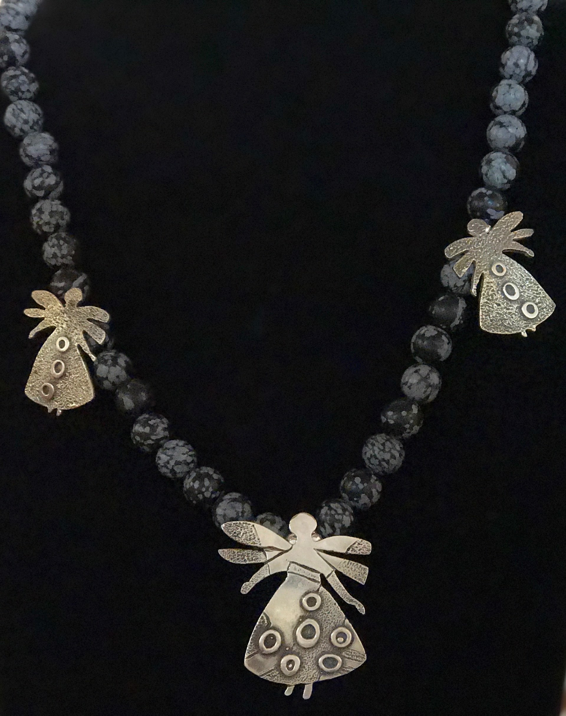 Pollinator necklace on snowflake obsidian beads by Melanie Yazzie