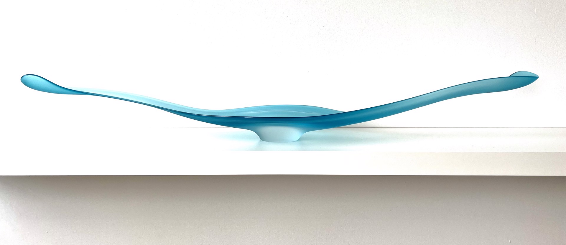Copper Blue Camber by The Goodman Studio is a light blue elongated abstract form. Perfect for a table. 