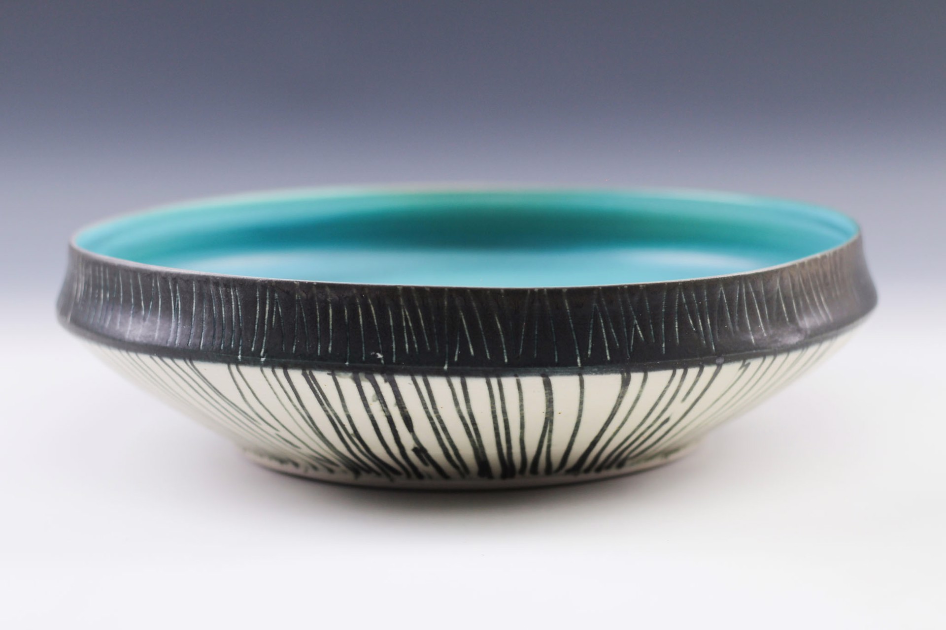 Large Black Rim Bowl by Delores Fortuna